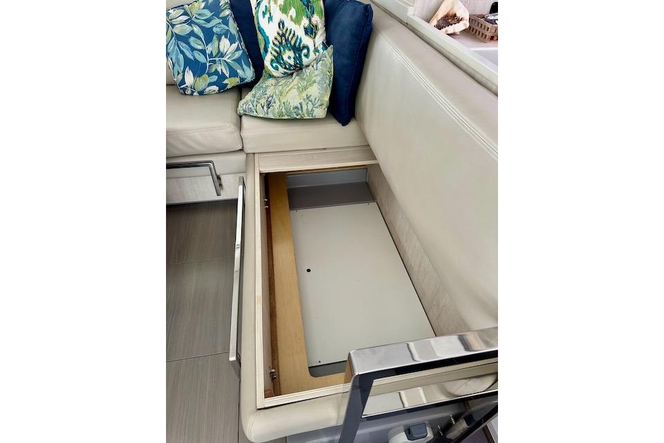 Interior storage compartment in a 2017 Leopard 40 yacht with decorative cushions.