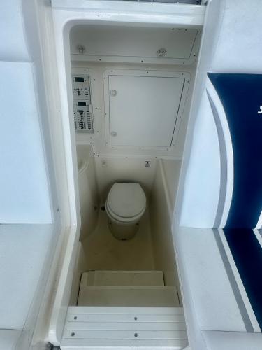 2008 SeaVee 390B boat interior with compact marine toilet.