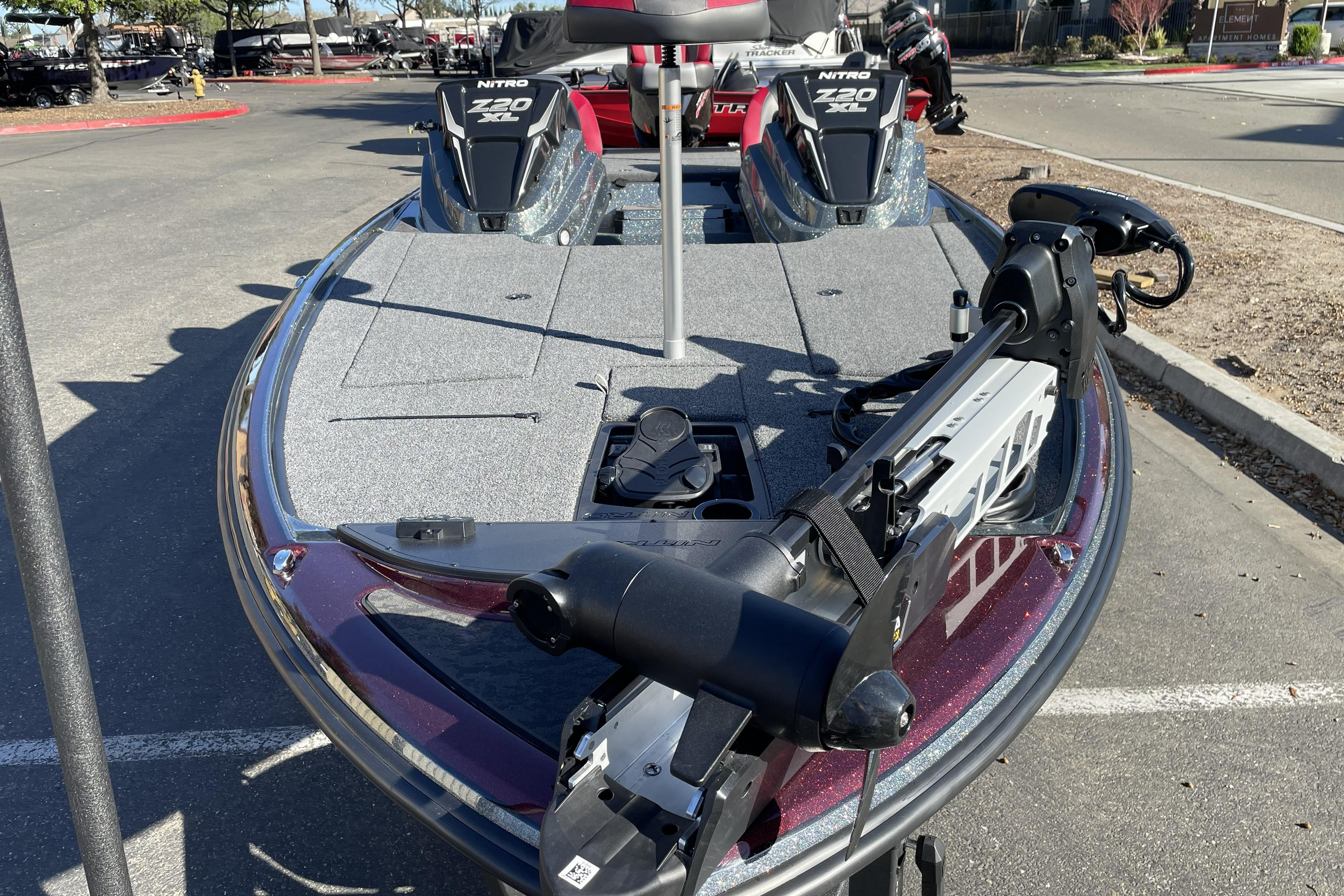 2026 Nitro Z20 XL boat with advanced trolling motor in a parking lot.