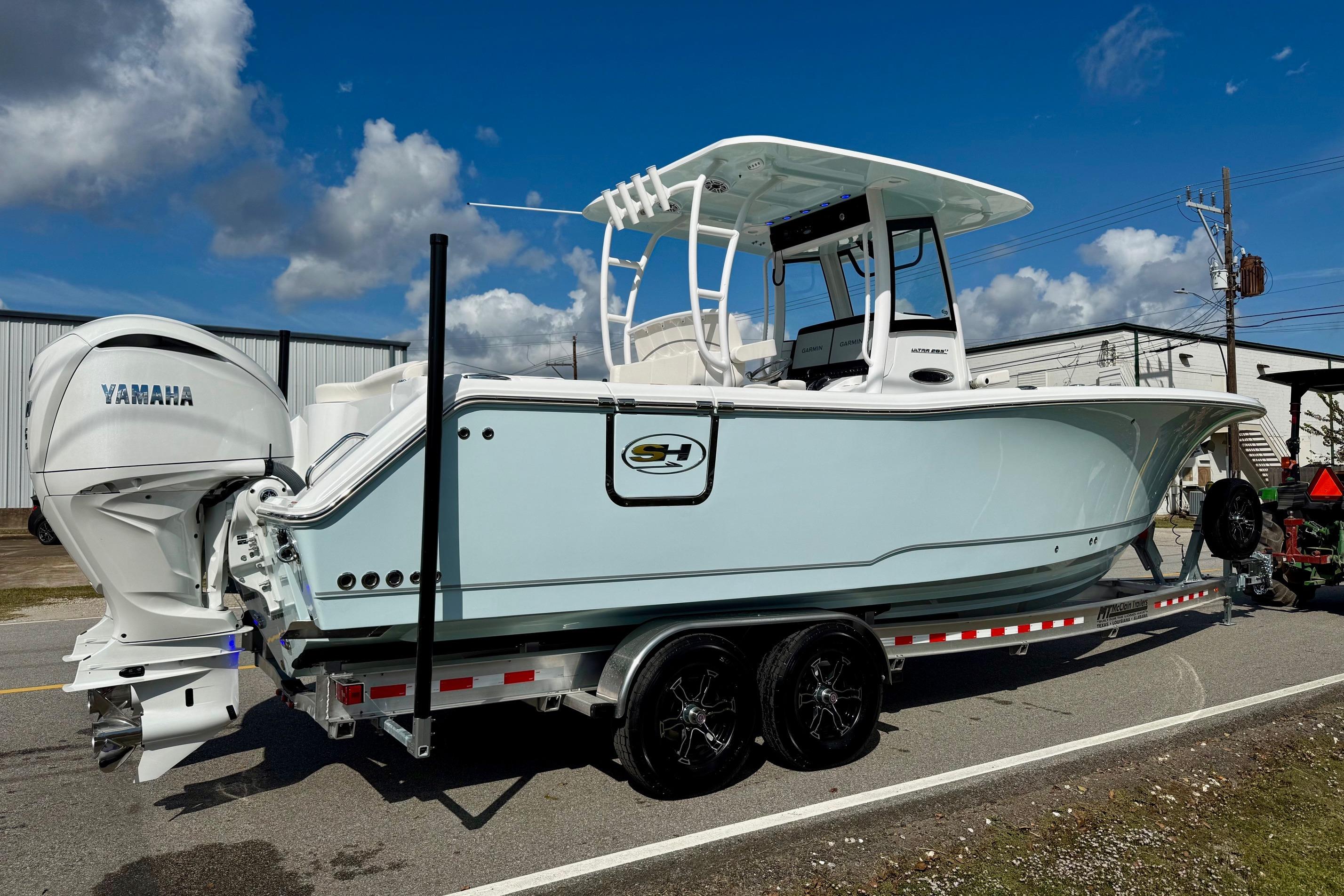 2026 Sea Hunt Ultra 285 Coffin Box boat on trailer, featuring Yamaha engines.