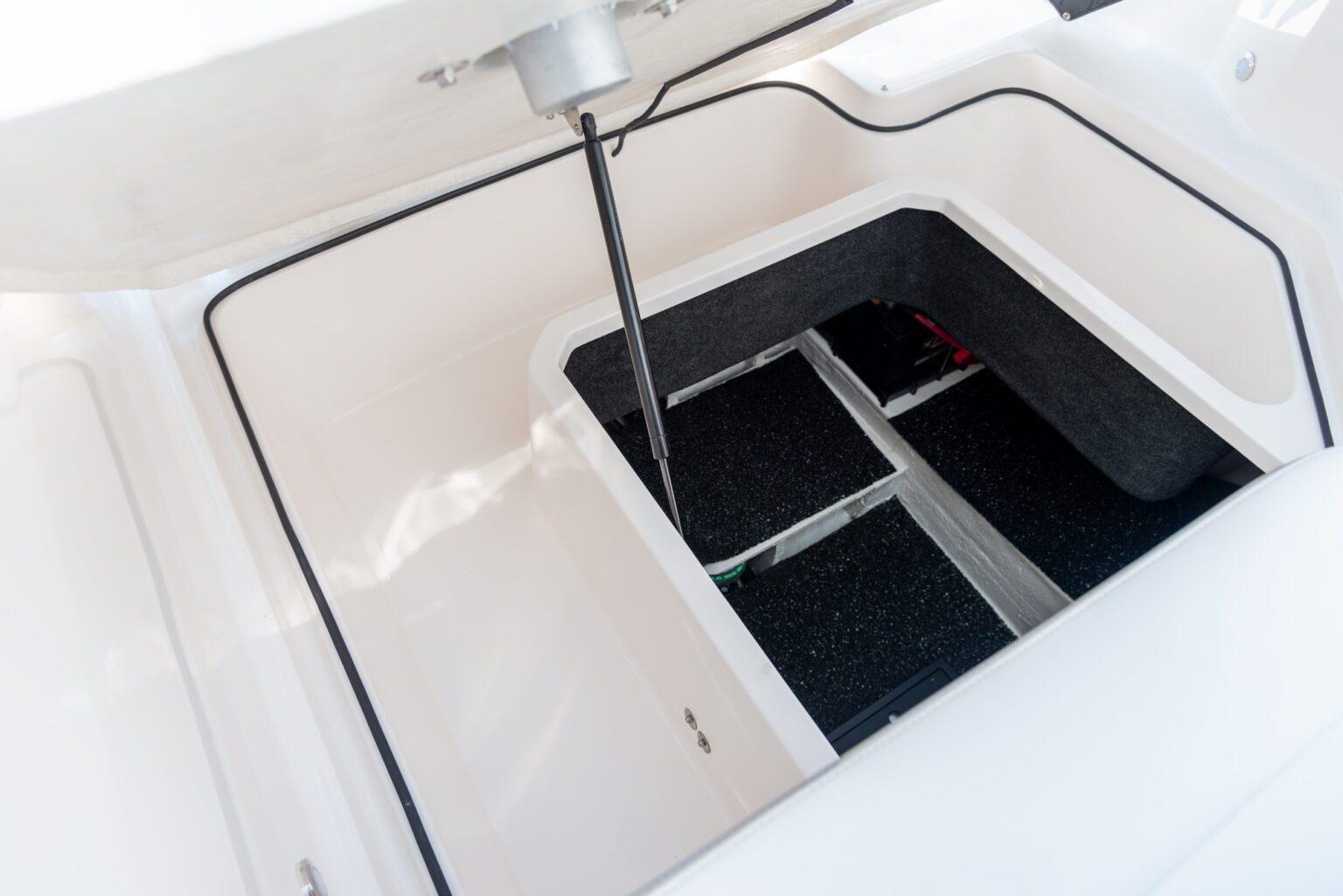 Storage compartment of 2022 Regal 26 XO boat, featuring spacious interior design.