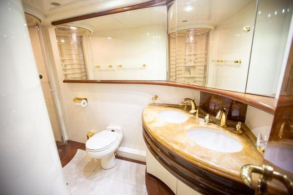 Luxurious bathroom in 2003 Azimut 74 Solar yacht with dual sinks and elegant fixtures.