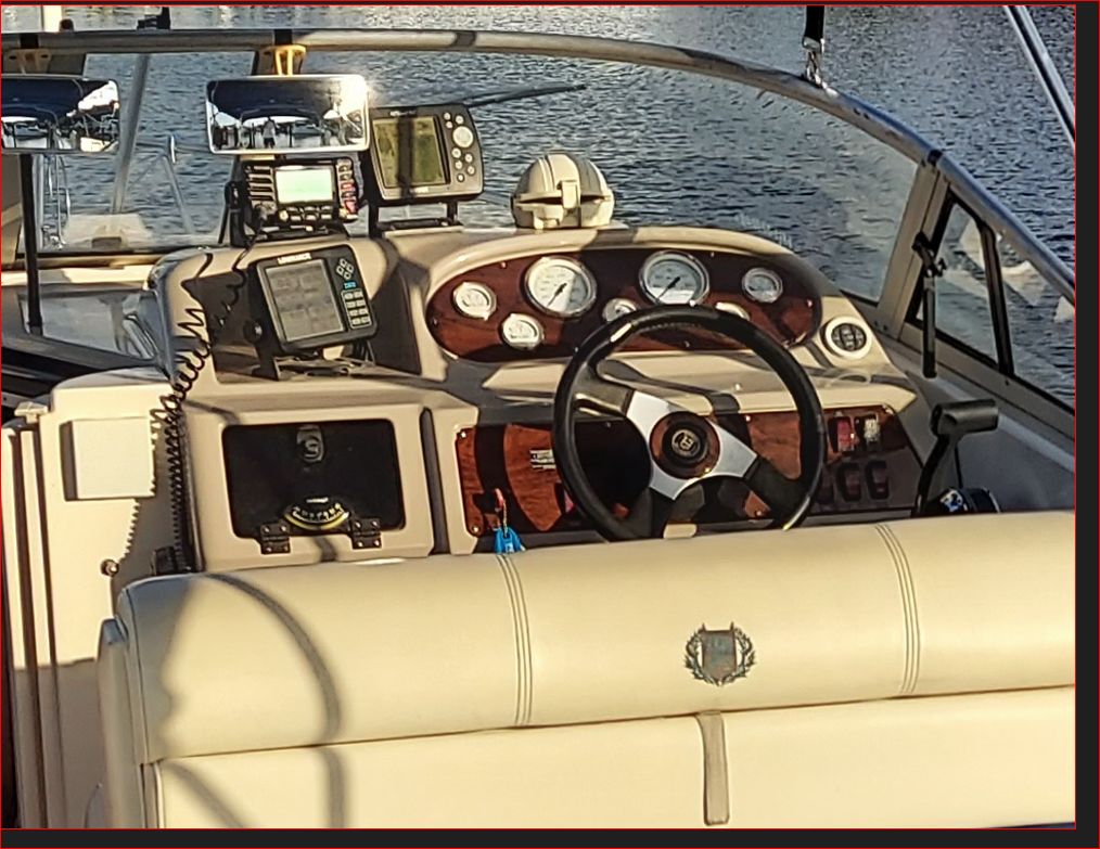 1997 Donzi 275LXC cockpit with steering wheel and instruments.