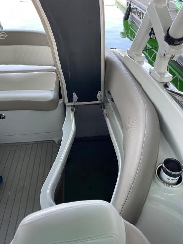 2019 Crownline E255 boat interior with open storage compartment and seating.