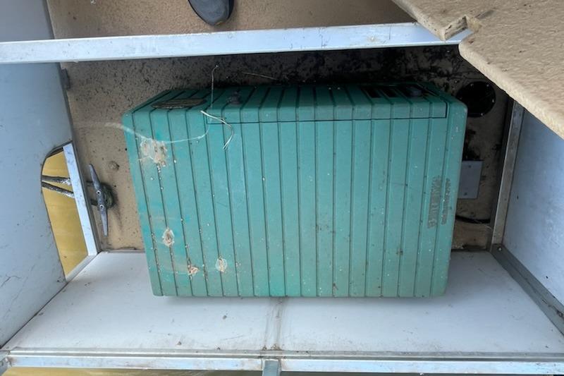 Green generator in a compartment of a 1995 Myacht 40X13 houseboat.