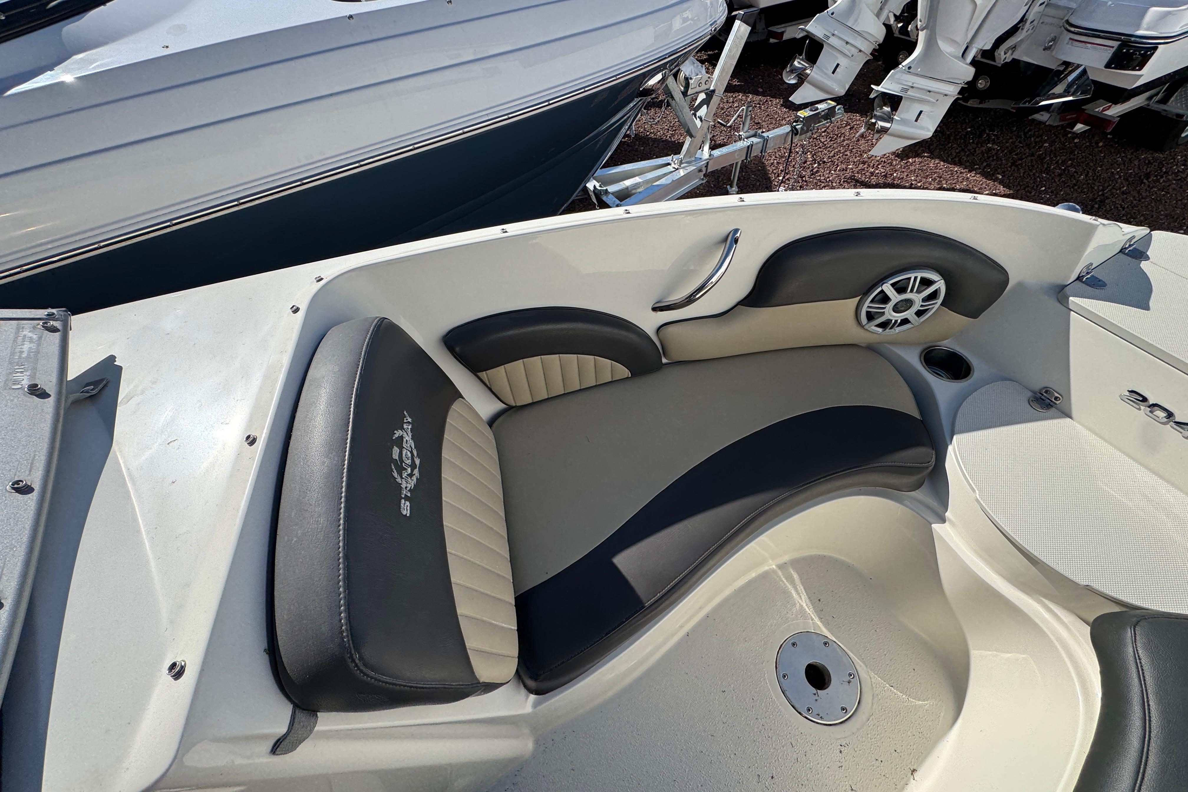 2018 Stingray 204 LR boat interior with cushioned seating and speaker.
