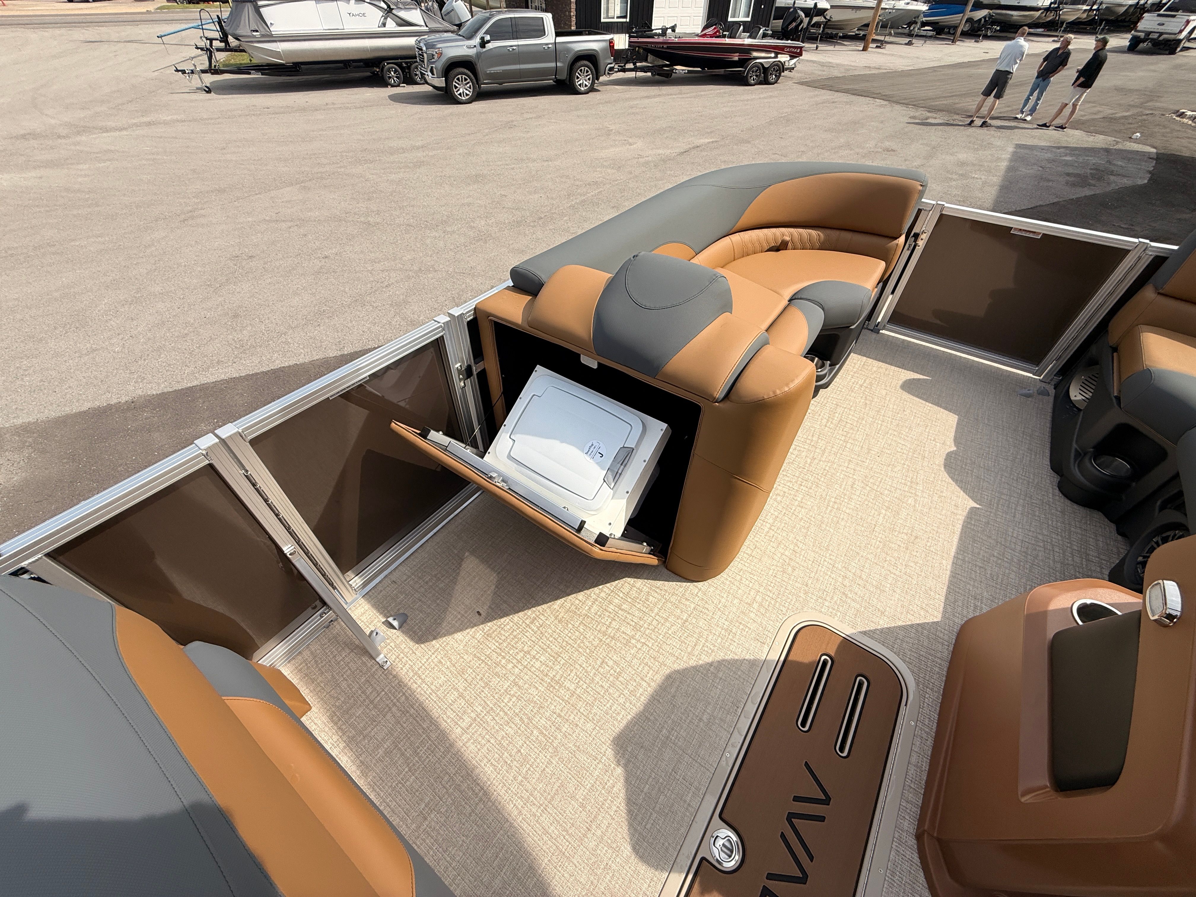 2026 Avalon 2385 LSZ pontoon boat with luxurious seating and storage area.