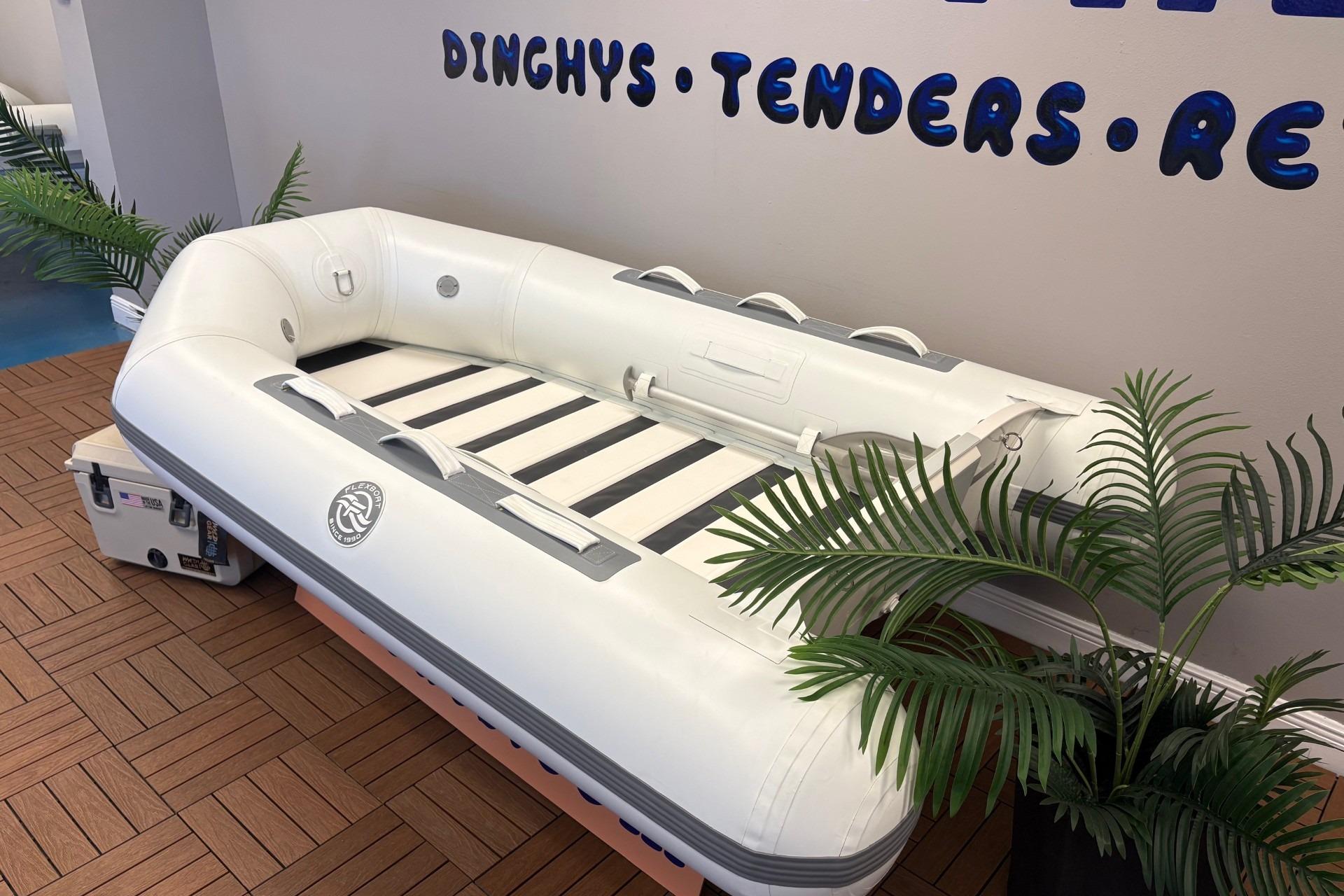 2025 Flexboat TD-8 inflatable dinghy displayed indoors with decorative plants.