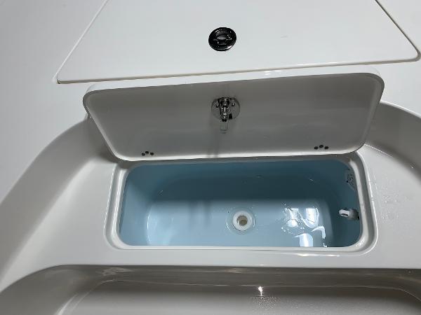 Livewell compartment on 2026 Key West 188 Bay Reef boat, open and empty.