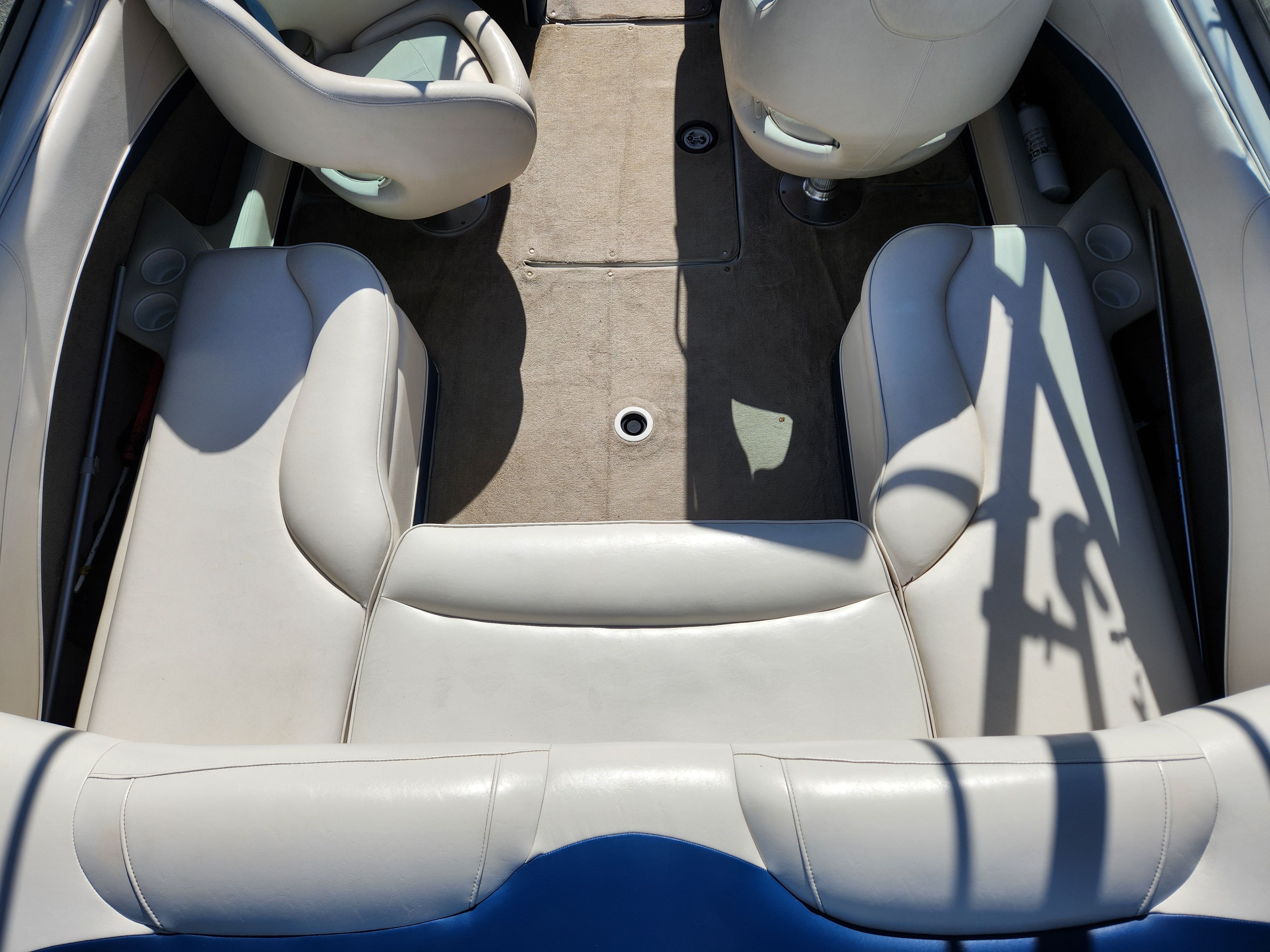 Interior of a 2003 Crownline 225 BR boat with beige seating.