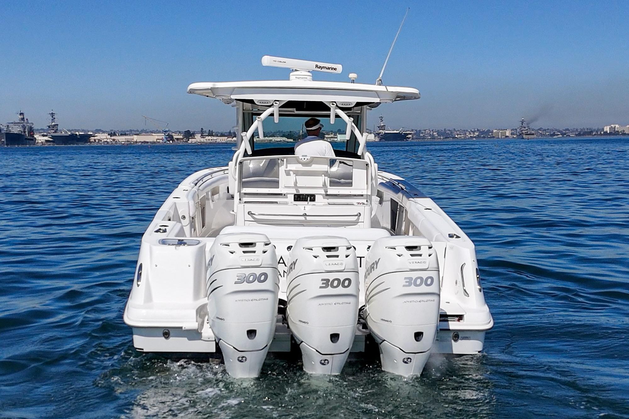 2015 Boston Whaler 370 Outrage boat with triple Mercury engines on open water.