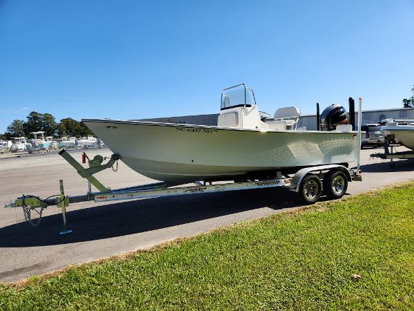 2023 May-Craft 208 CC boat on trailer, parked outdoors on sunny day.