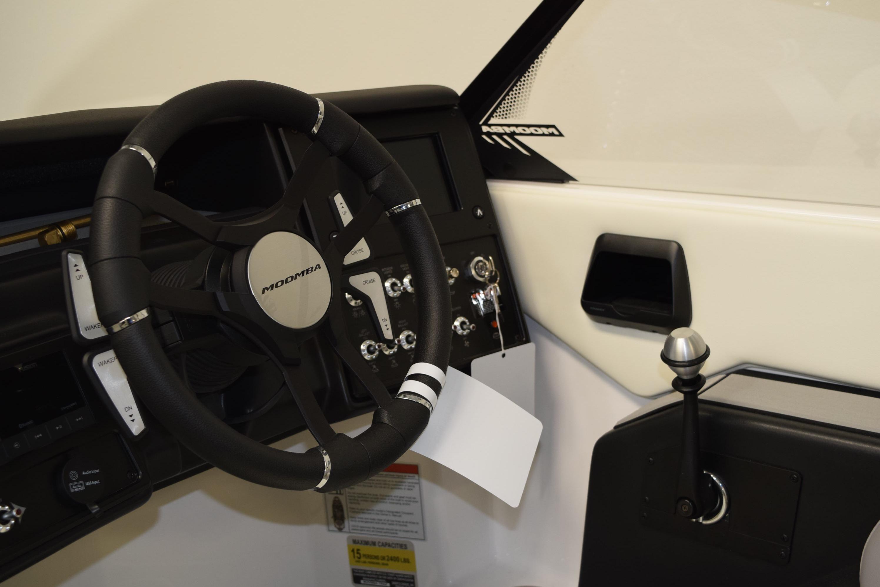 2026 Moomba Craz boat dashboard with steering wheel and control panel.