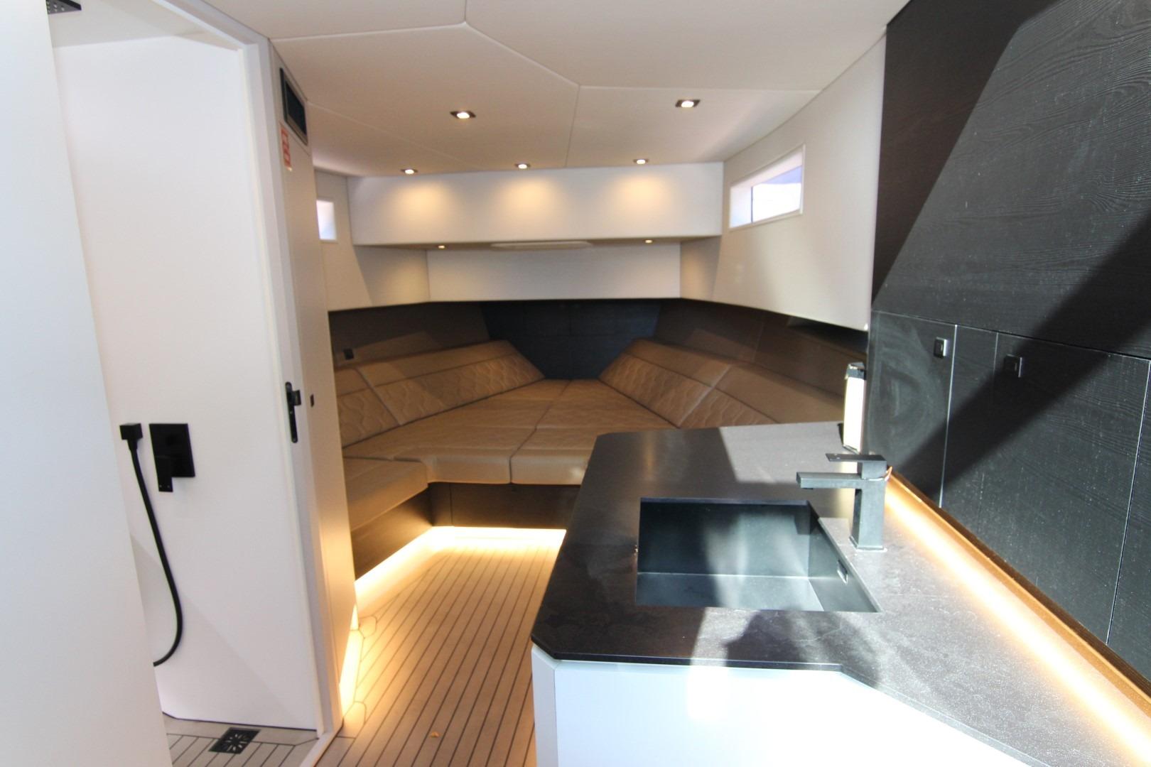 Luxurious interior of 2022 Vanquish Yachts VQ45, featuring modern design and ambient lighting.