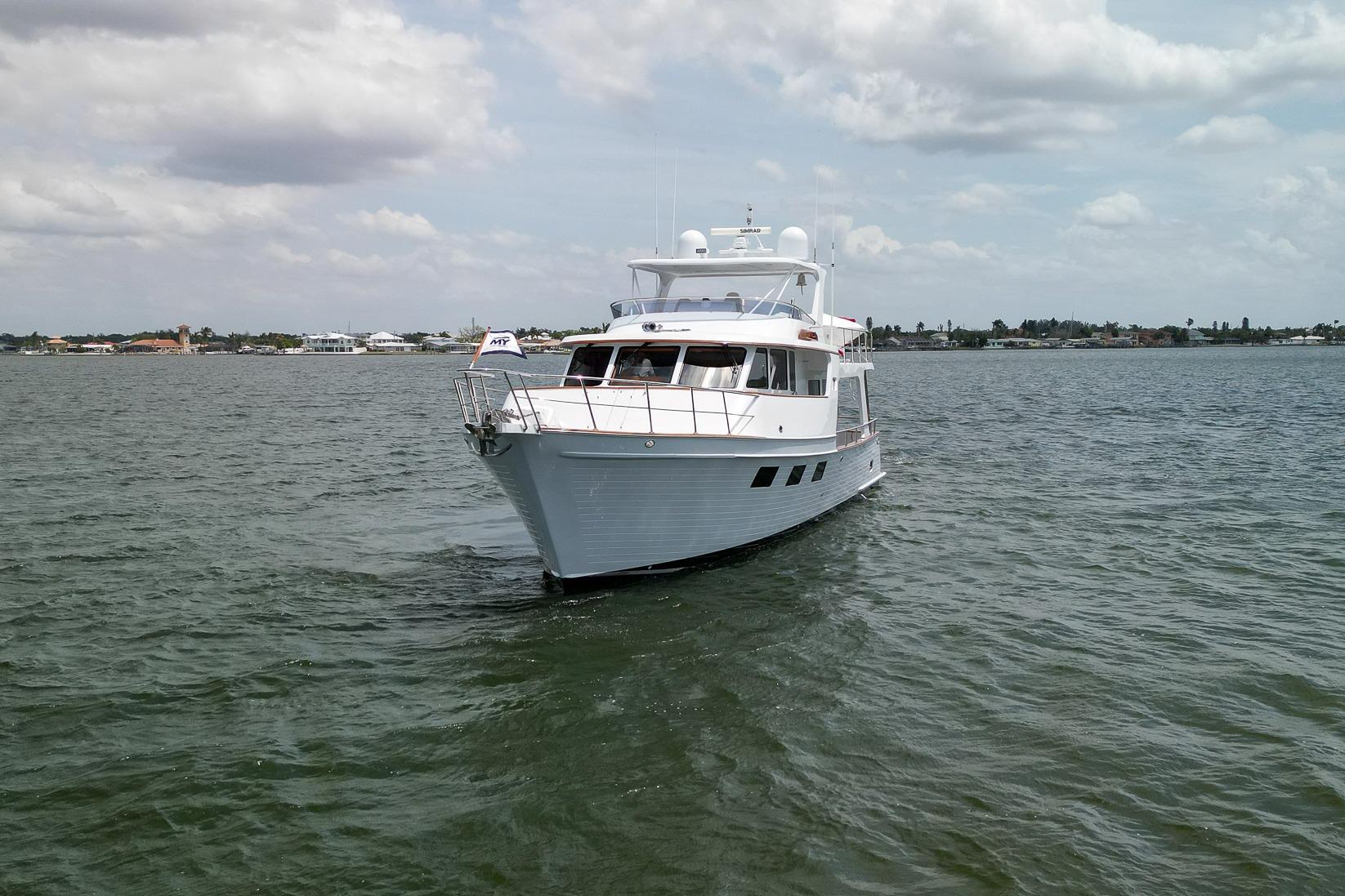 2015 Marlow Explorer 49E yacht cruising on open water under cloudy skies.