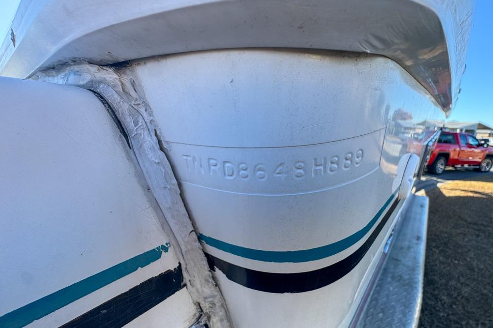 1989 Formula 292 SR-1 boat hull with visible identification number, parked outdoors.