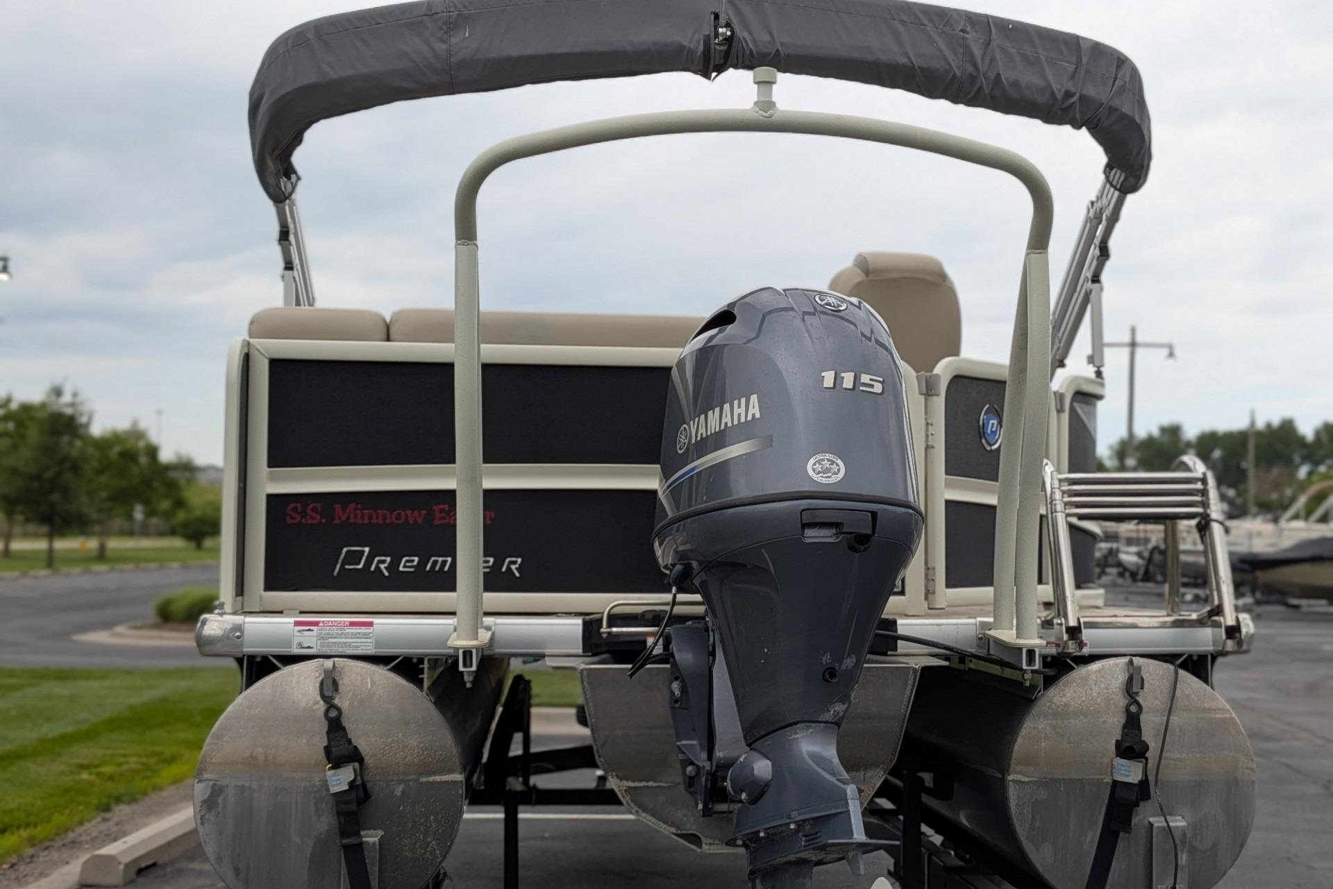 2018 Premier 220 SunSation pontoon boat with Yamaha 115 outboard motor, rear view.