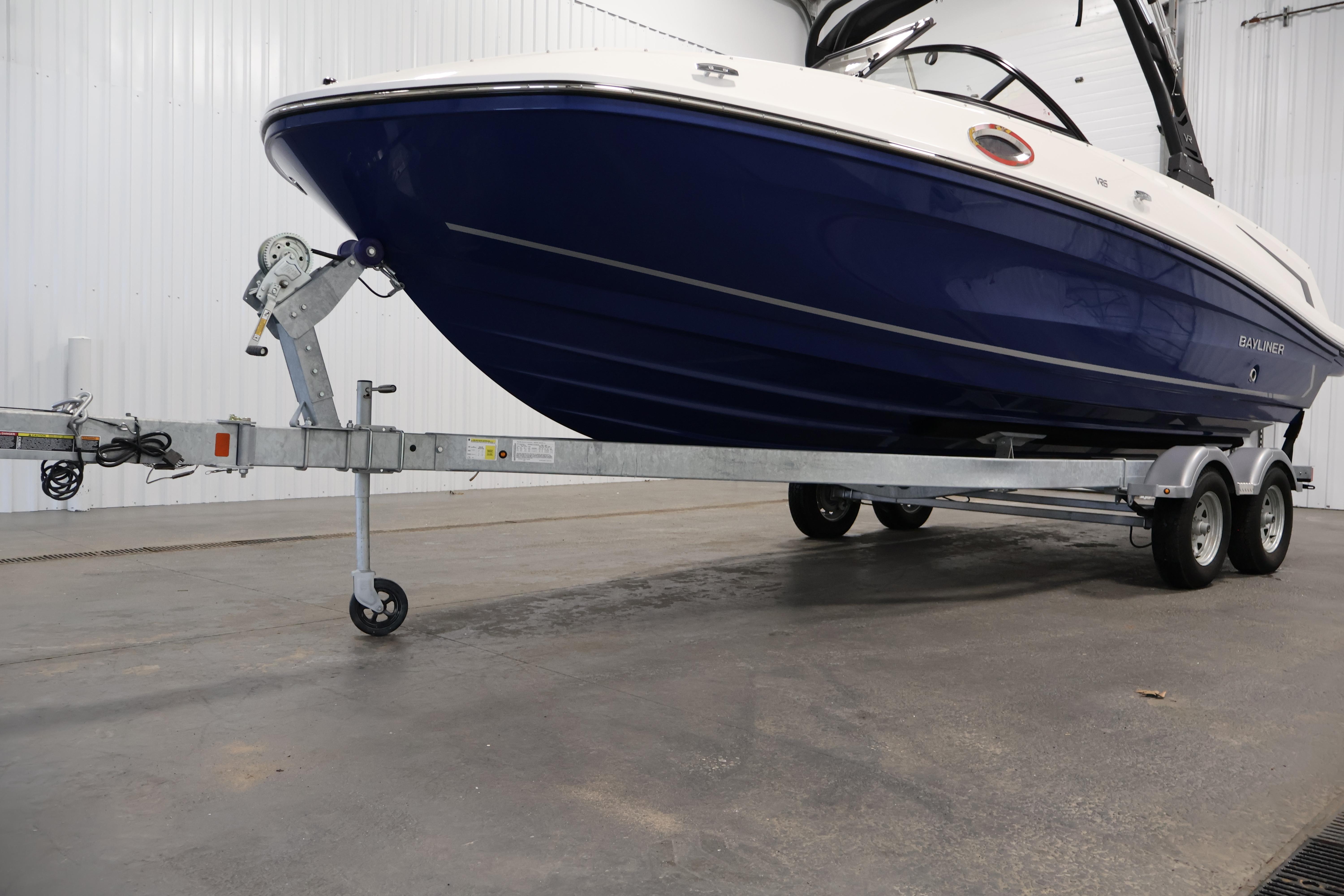 2026 Bayliner VR6 Bowrider I/O on trailer in indoor storage facility.