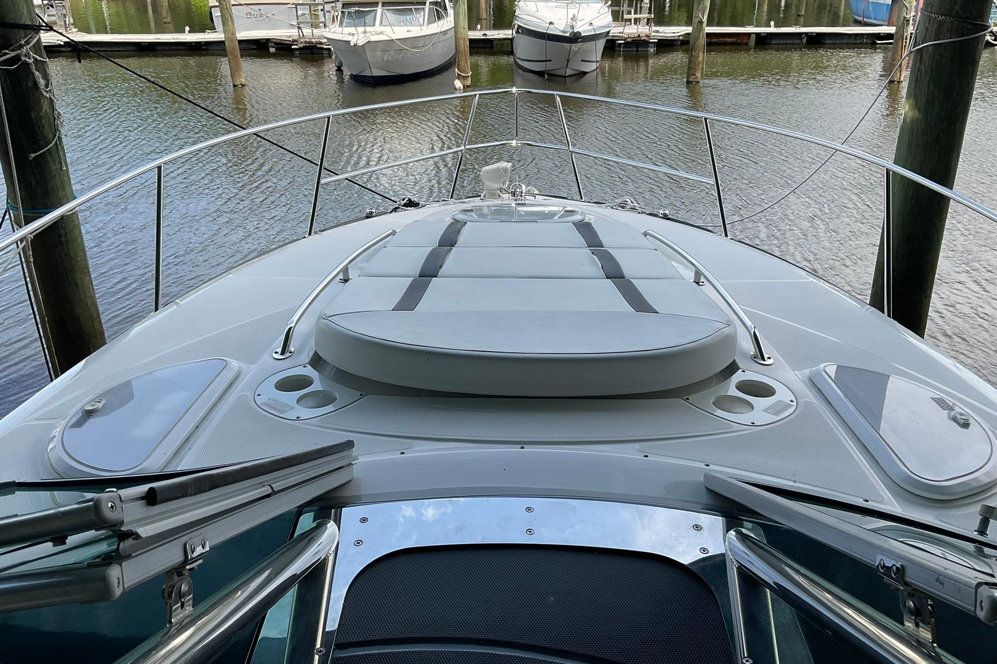 2019 Monterey 335 Sport Yacht docked, showcasing sleek deck design and luxurious features.