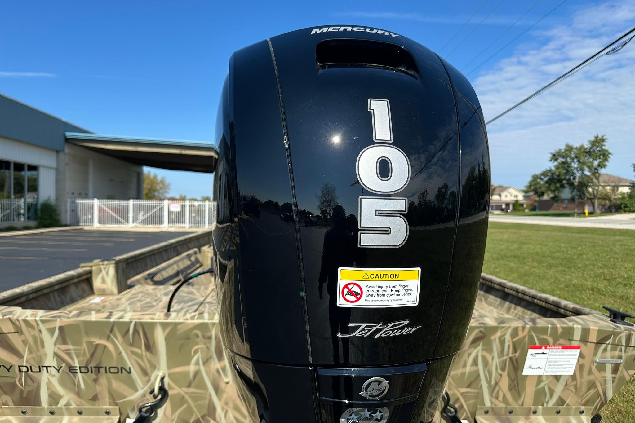 2026 Lowe Roughneck 2070CC with Mercury 105 Jet Power engine, camo design, outdoors.