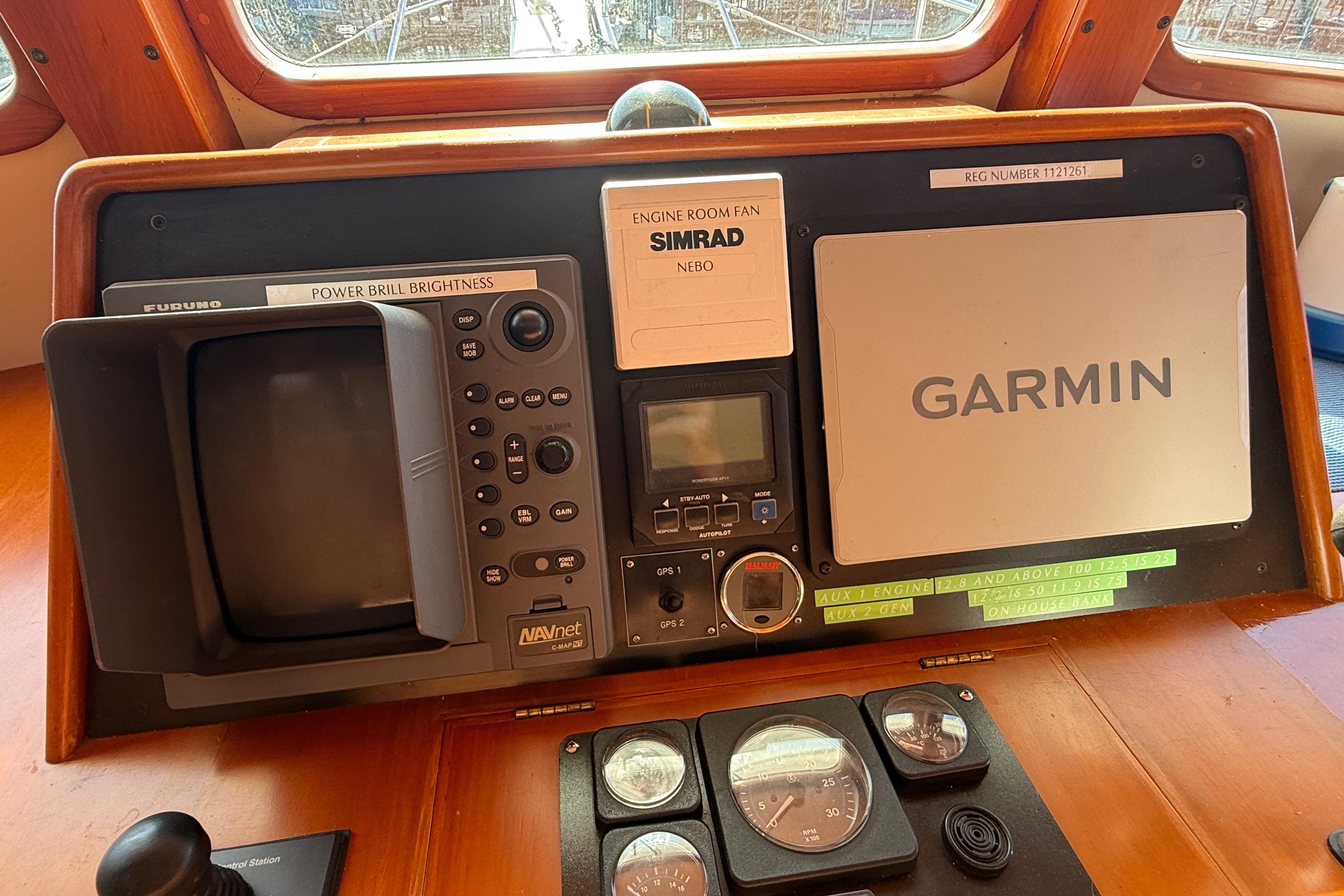 Kadey-Krogen 39 (2001) boat dashboard with Garmin and Furuno navigation systems.