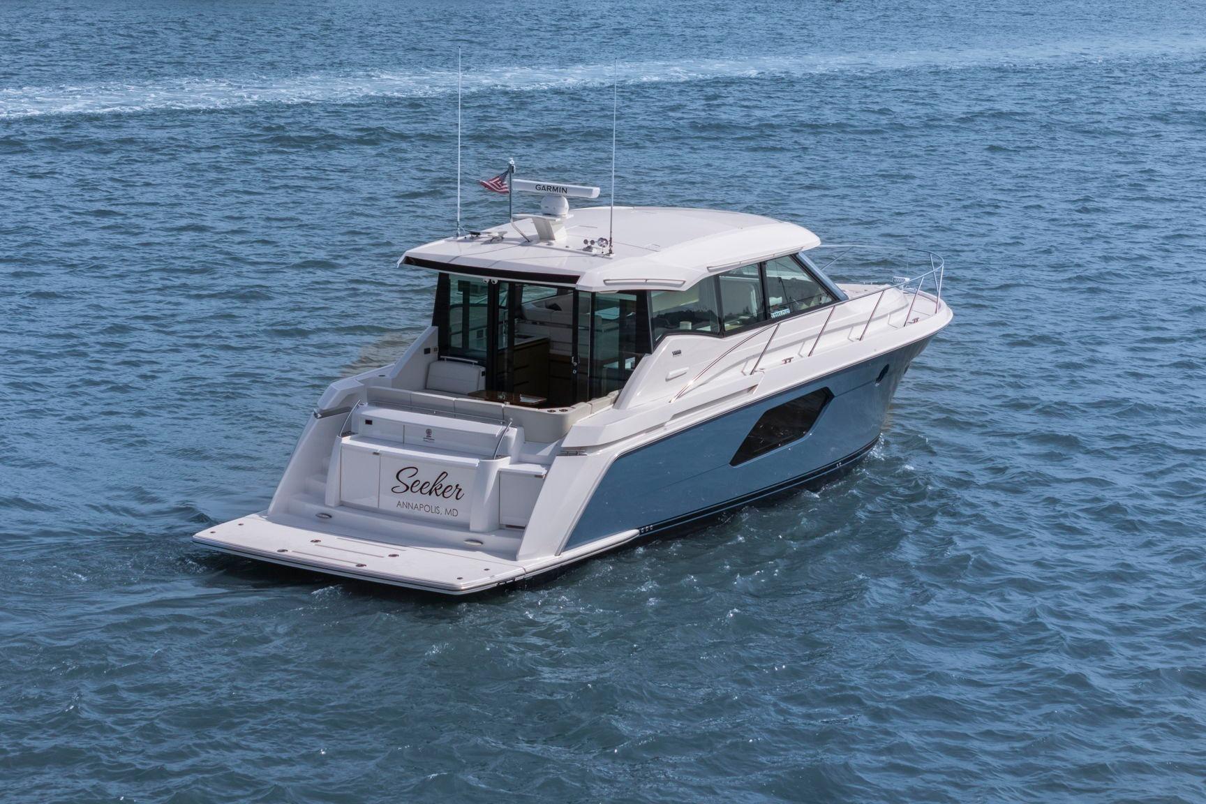 2023 Tiara Yachts C49 Coupe cruising on open water.