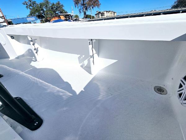 2026 Sea Hunt BX 22 BR boat interior, showcasing clean white deck and storage compartments.