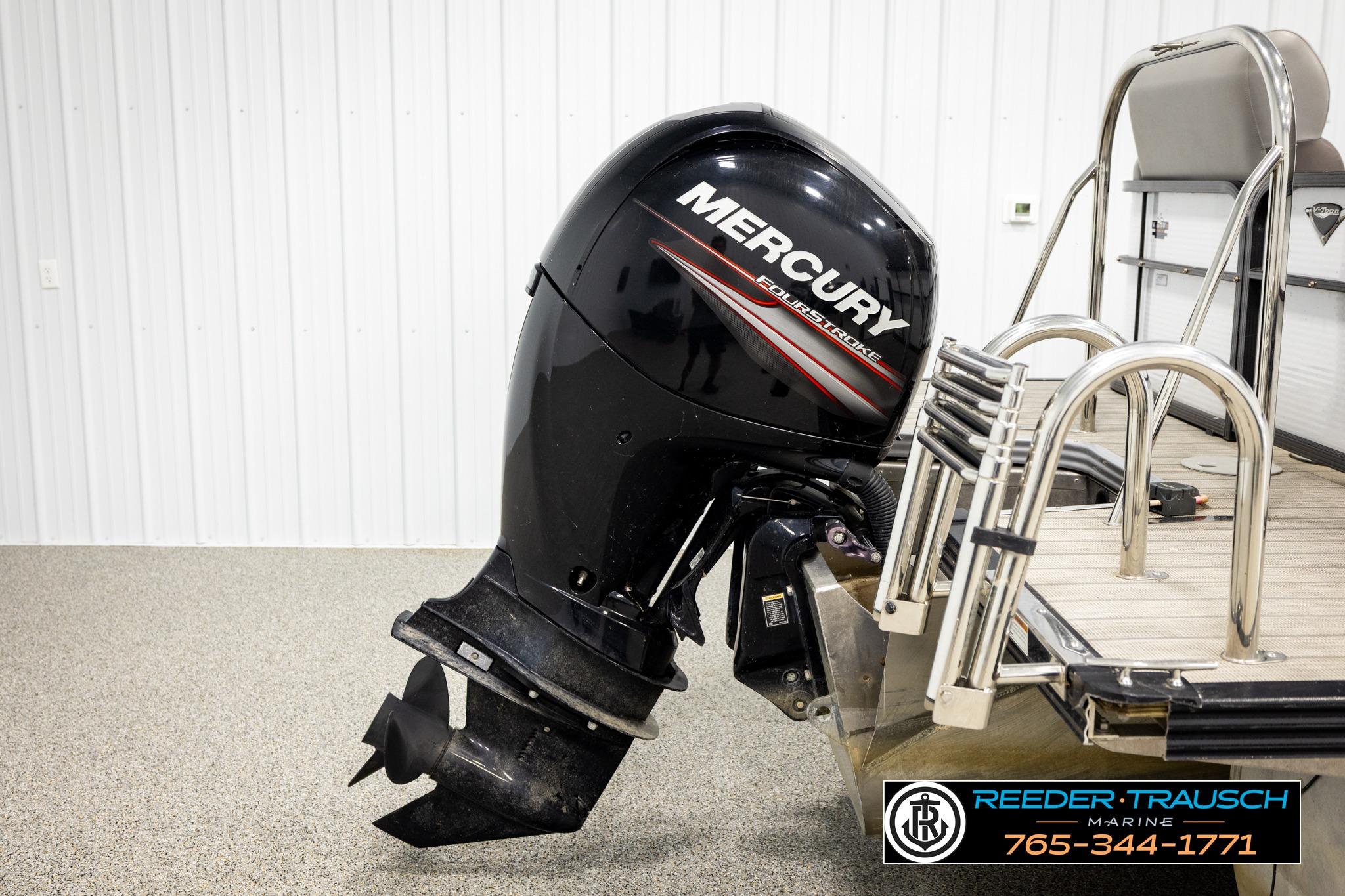 2019 Manitou Oasis SR VP with Mercury outboard motor in showroom setting.