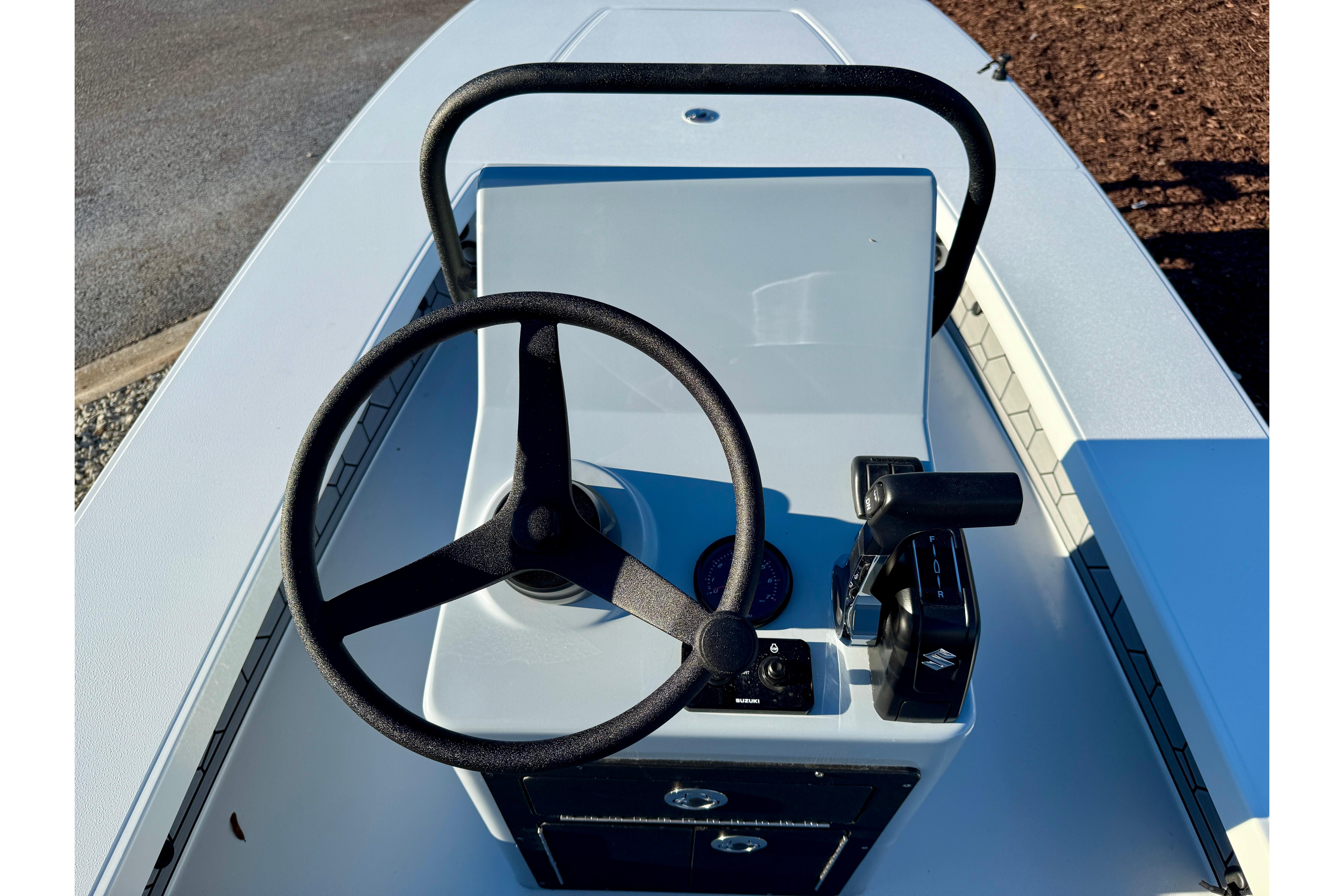 2026 East Cape EVO 17V boat console with steering wheel and controls.