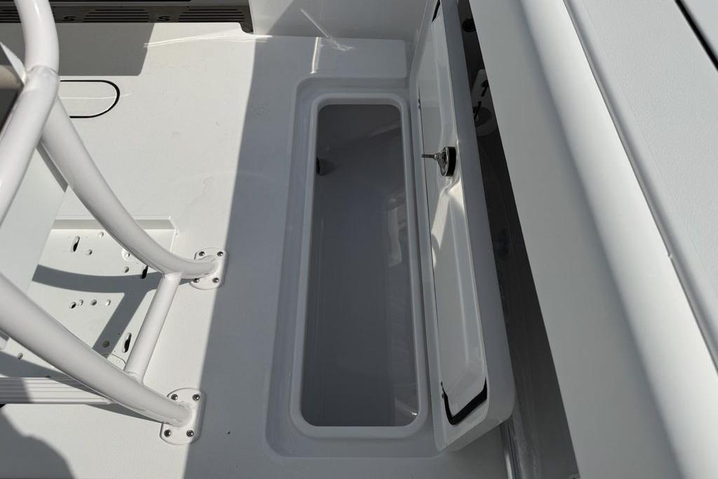 2026 Sportsman Open 252 Center Console storage compartment with open hatch.