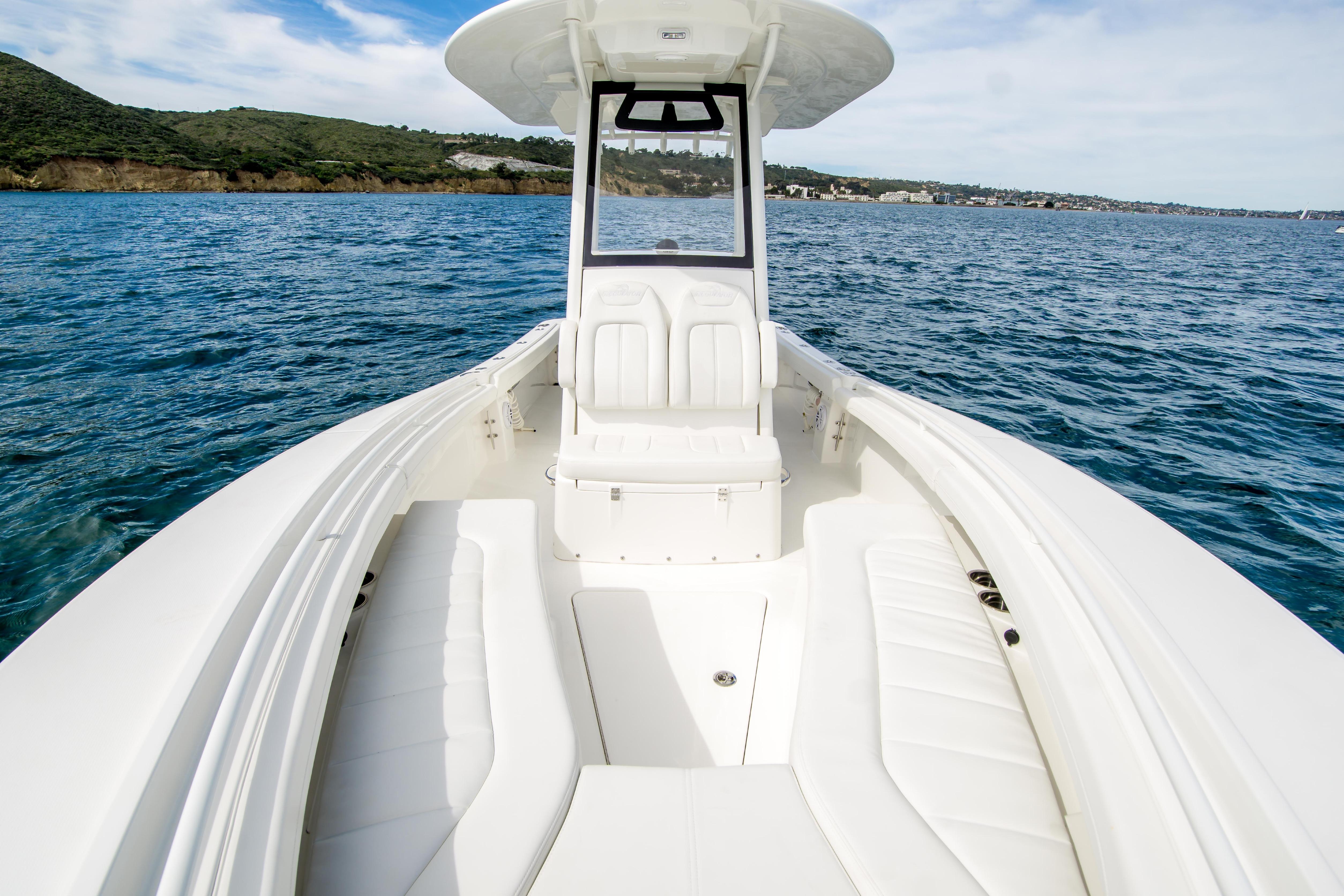 2026 Regulator 23 boat on open water, featuring spacious seating and sleek design.