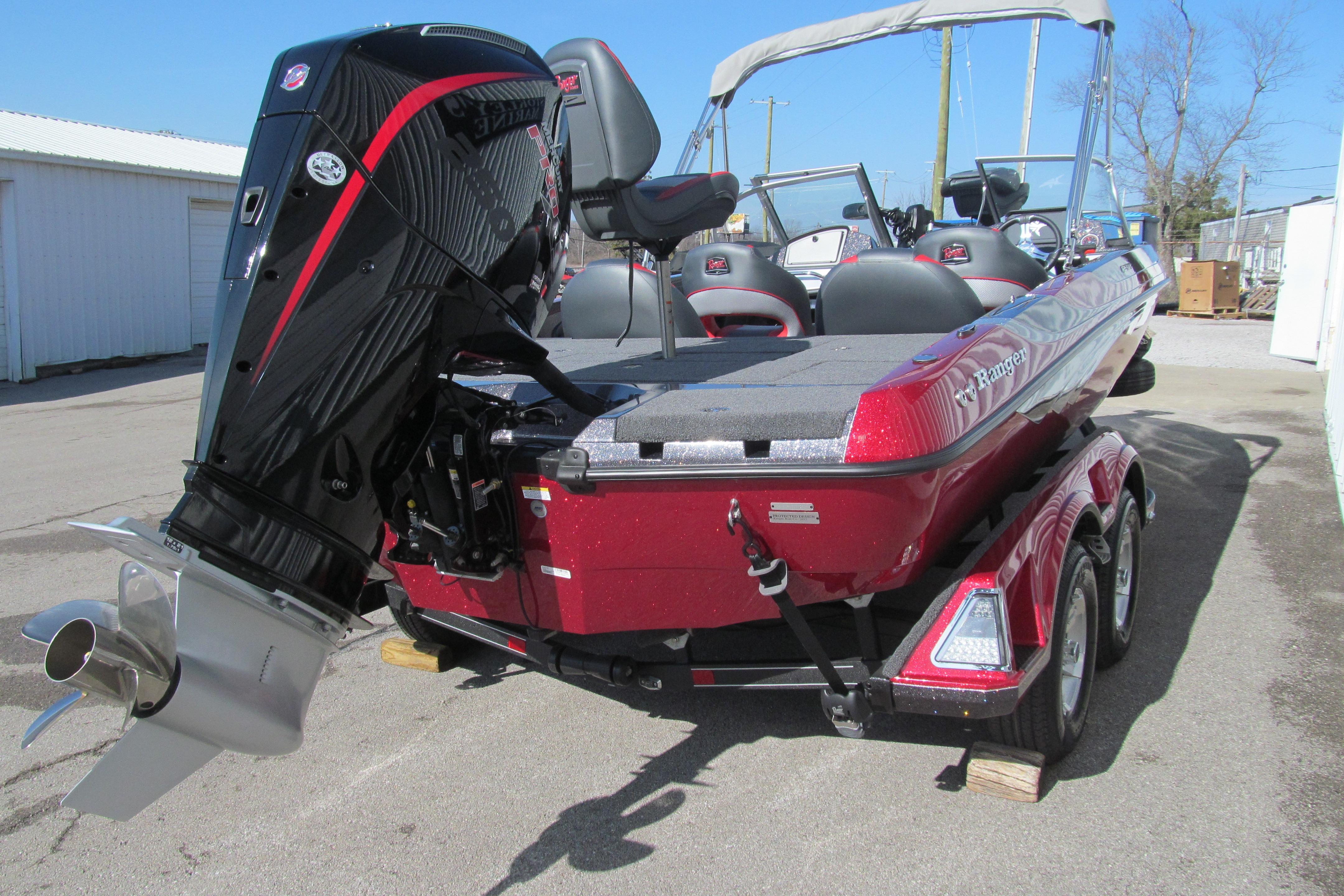 2026 Ranger 212LS boat with powerful outboard motor, red finish, and trailer.