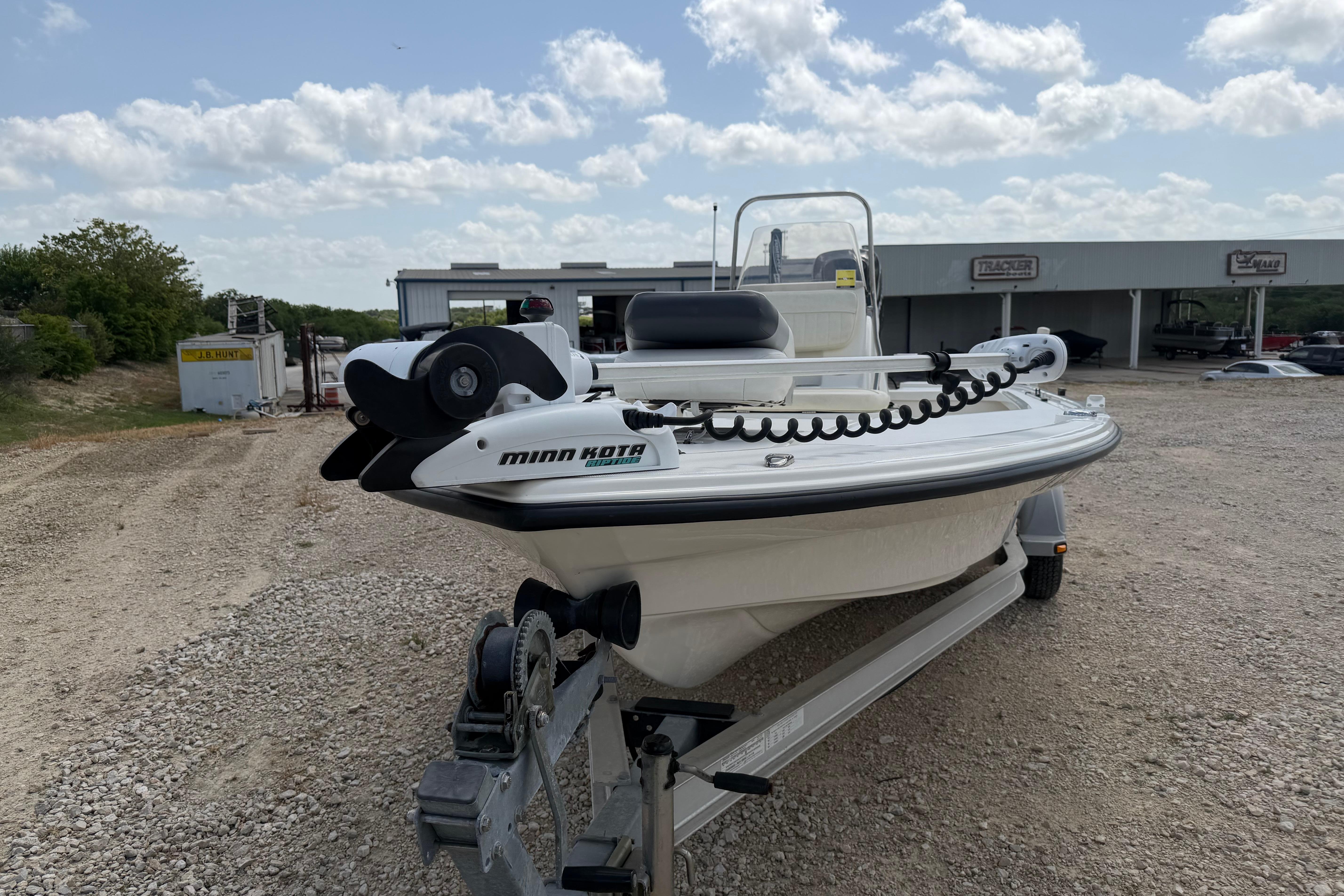 2012 Mako 18 LTS boat with Minn Kota trolling motor on a trailer, outdoors.