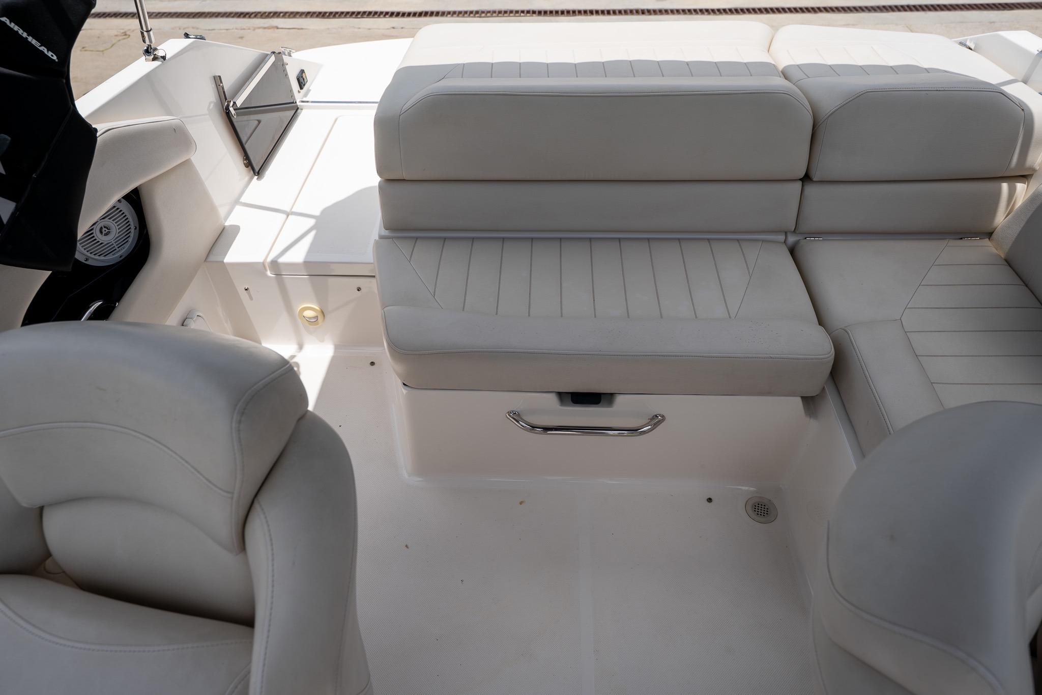 Interior seating of a 2008 Regal 2000 Bowrider boat, featuring white cushioned seats.