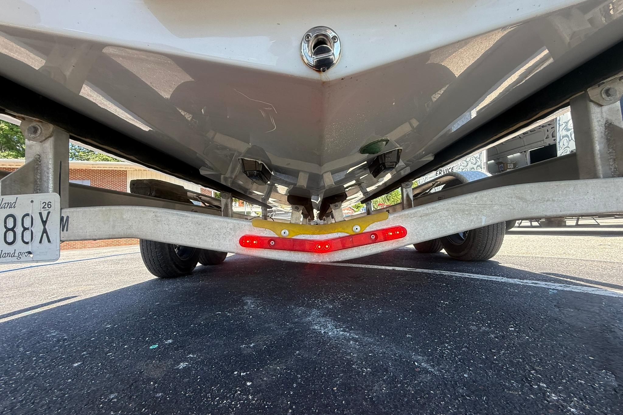 Underside view of 2024 Pair Customs 24 Center Console MV on a trailer.