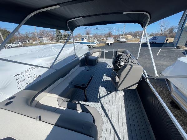 2025 Armada Saphir 23CR pontoon boat interior with seating and steering console.