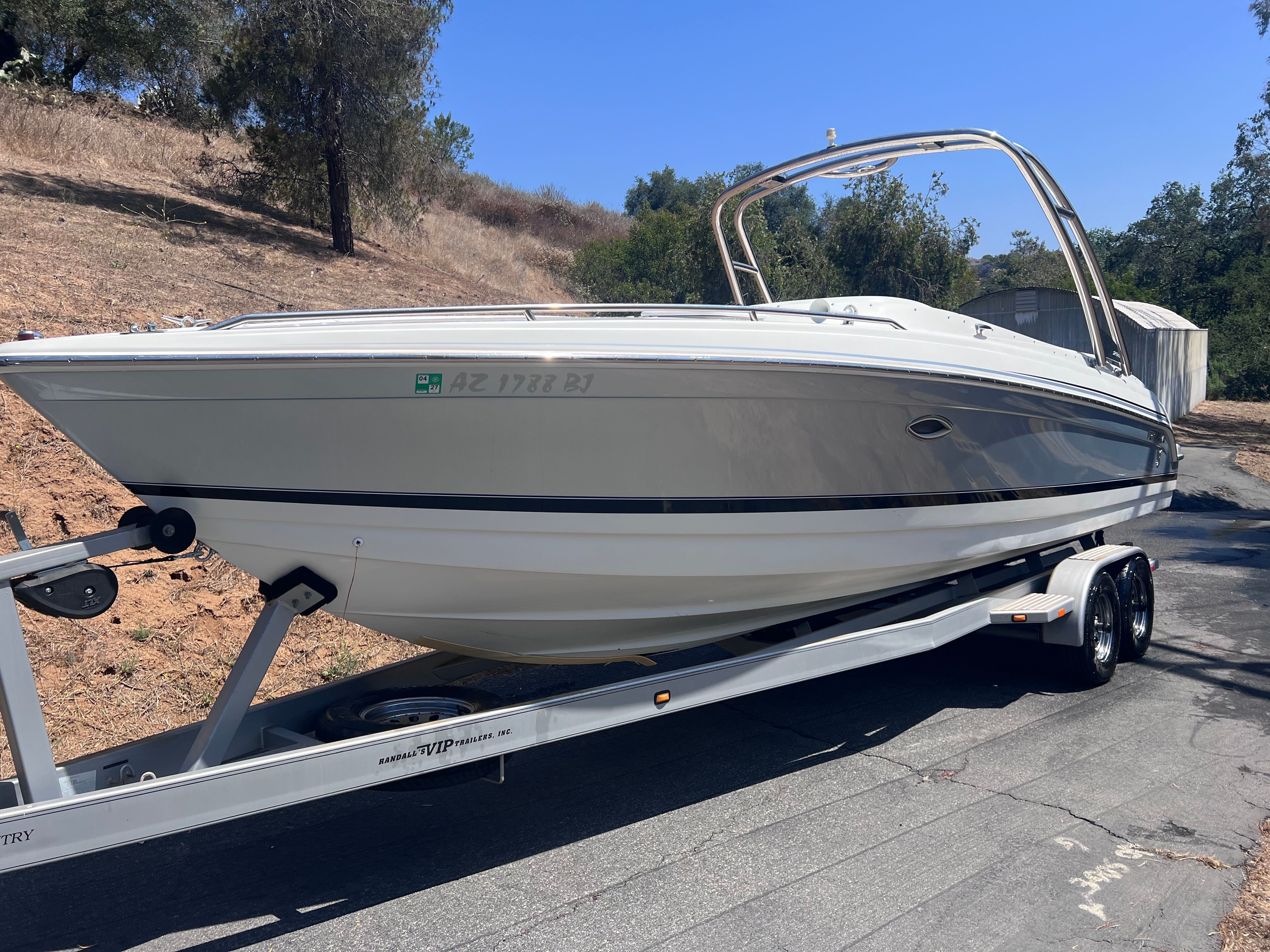 2006 Formula 260 Sun Sport boat on trailer, side view.