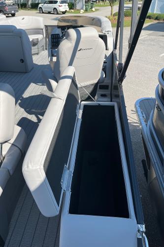 2024 Starcraft SLS 3 Q DH pontoon boat interior with open storage compartment.