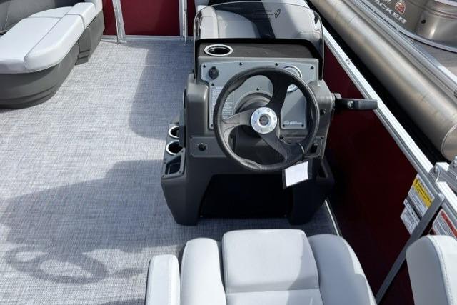 2026 Sun Tracker Party Barge 16 DLX interior with steering console and seating.