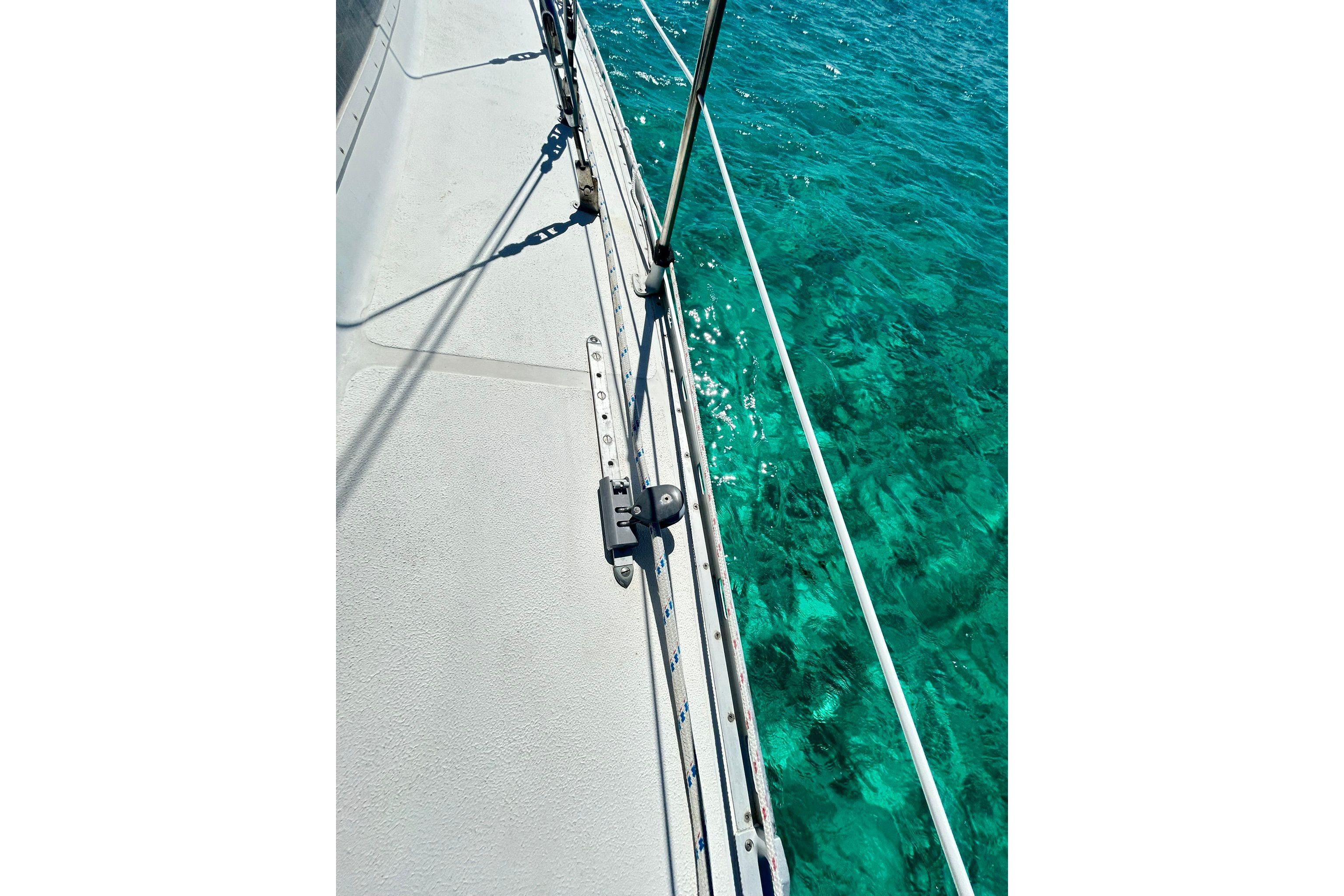 Deck view of 1987 Gulfstar CSY 50 Pilot House sailboat over clear turquoise water.