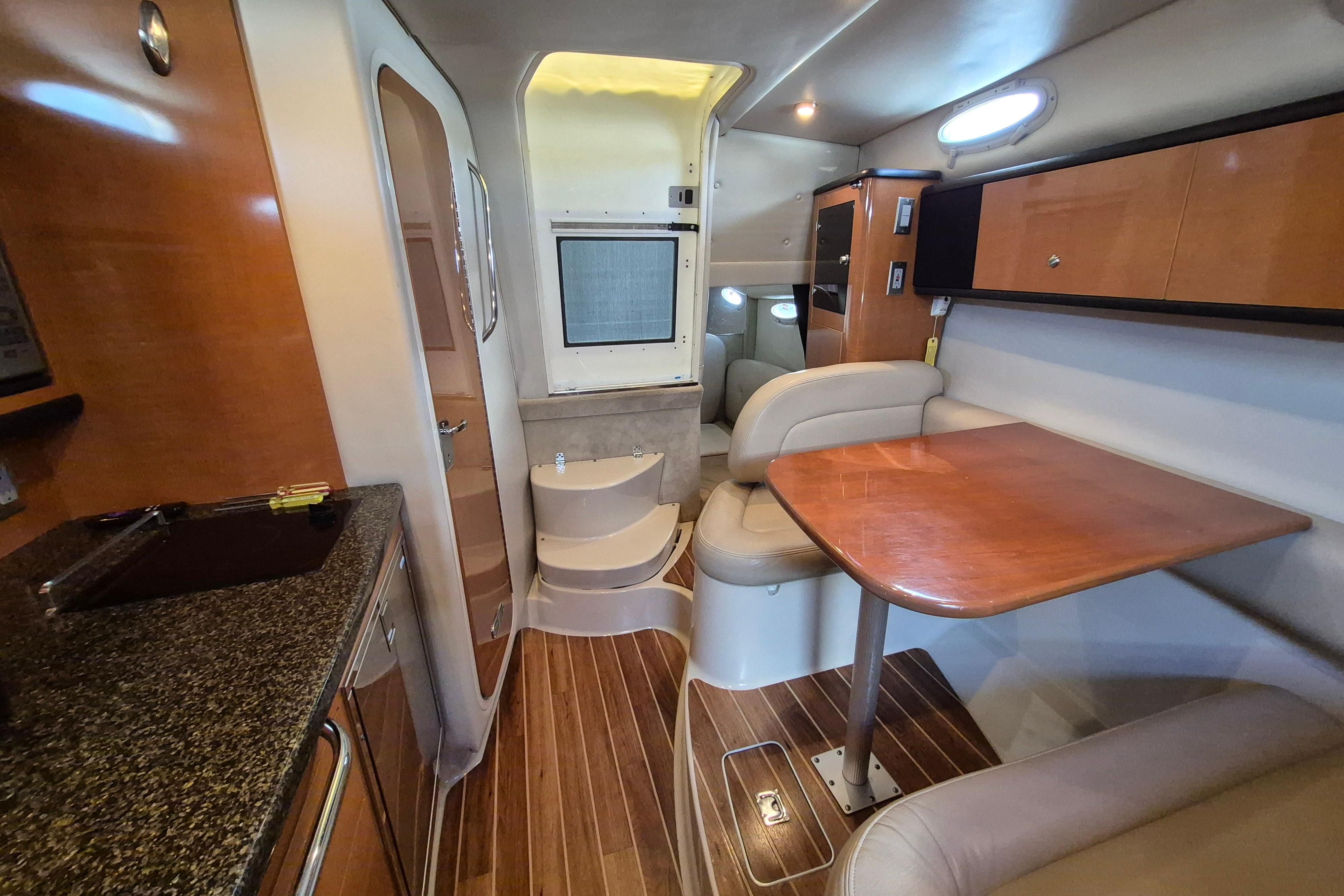2008 Chaparral Signature 280 interior with wood accents, dining area, and modern amenities.