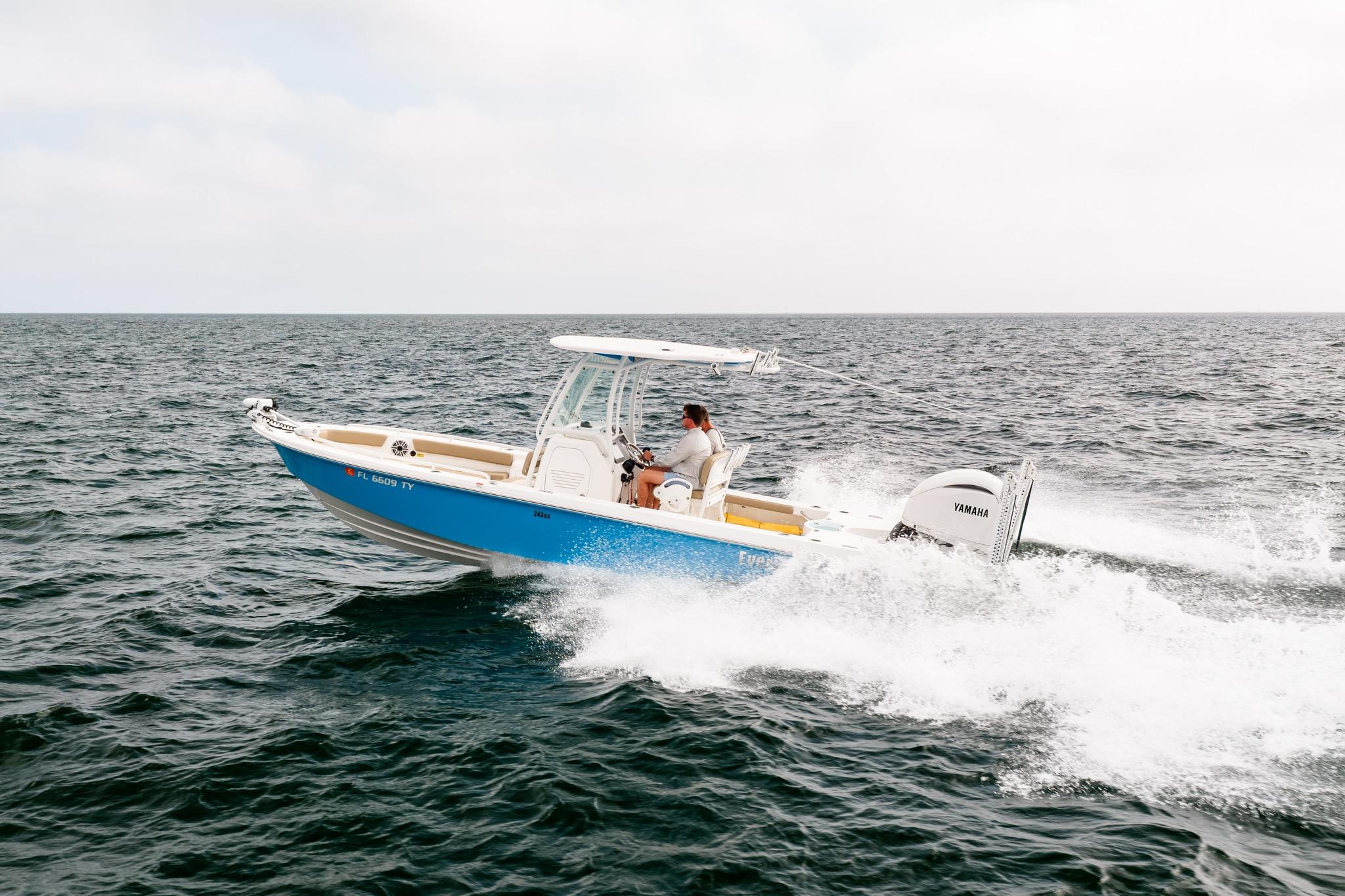 2023 Everglades 243 Center Console boat cruising on open water.