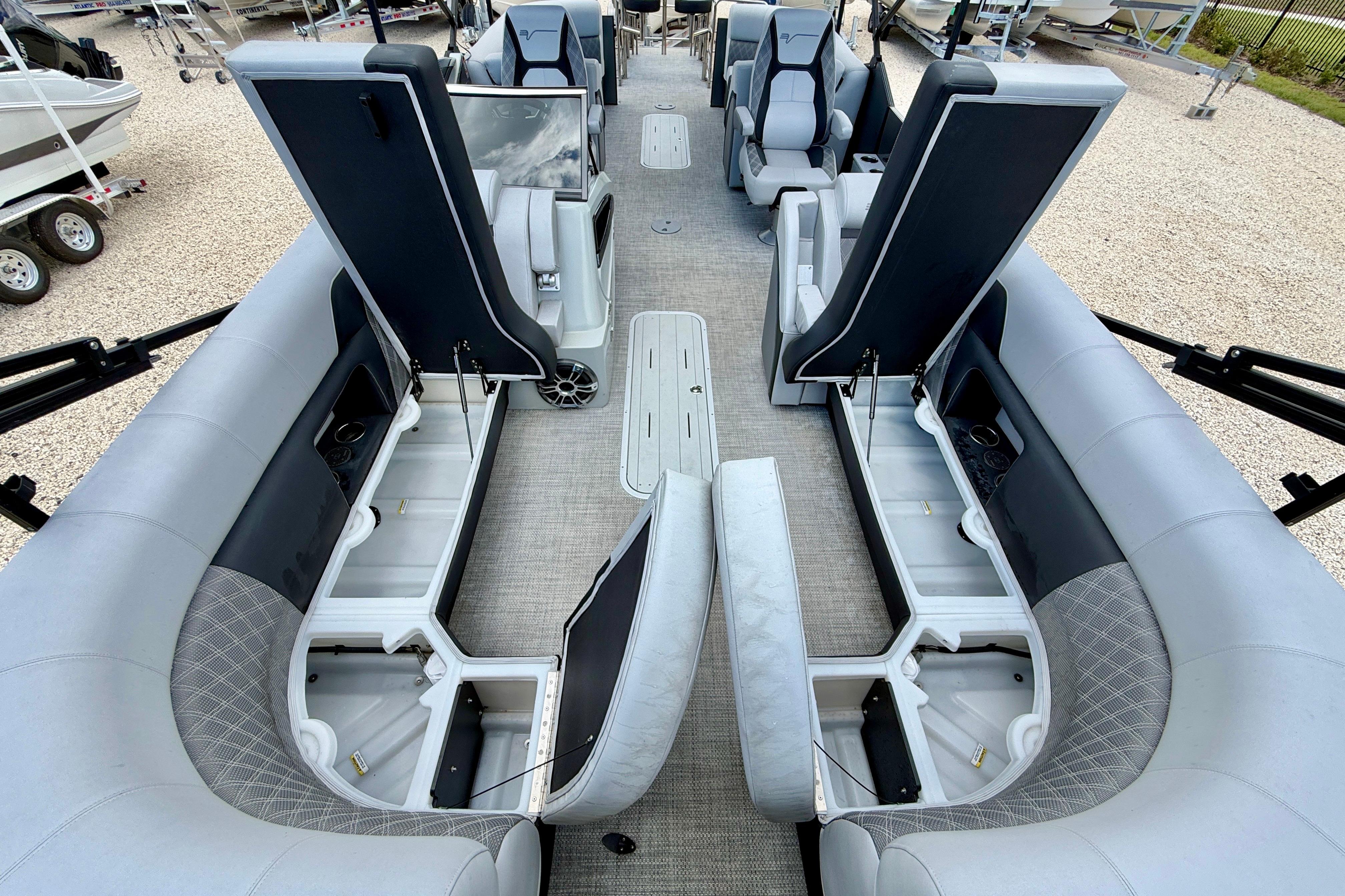 Interior view of 2025 Vanderbilt 700T boat with open storage compartments and seating.