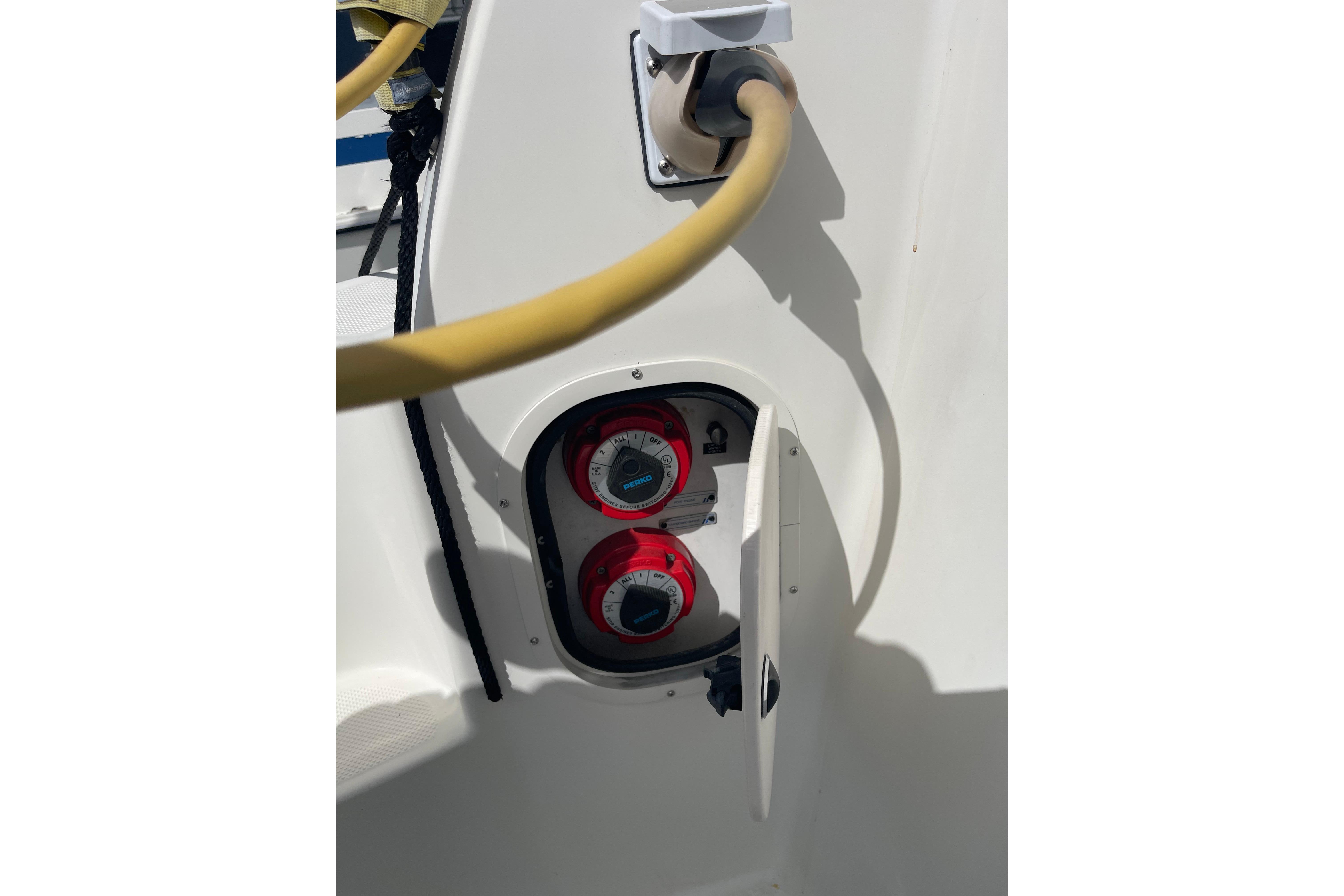 Battery switches and power cable on a 1996 Bayliner 3255 Avanti boat.