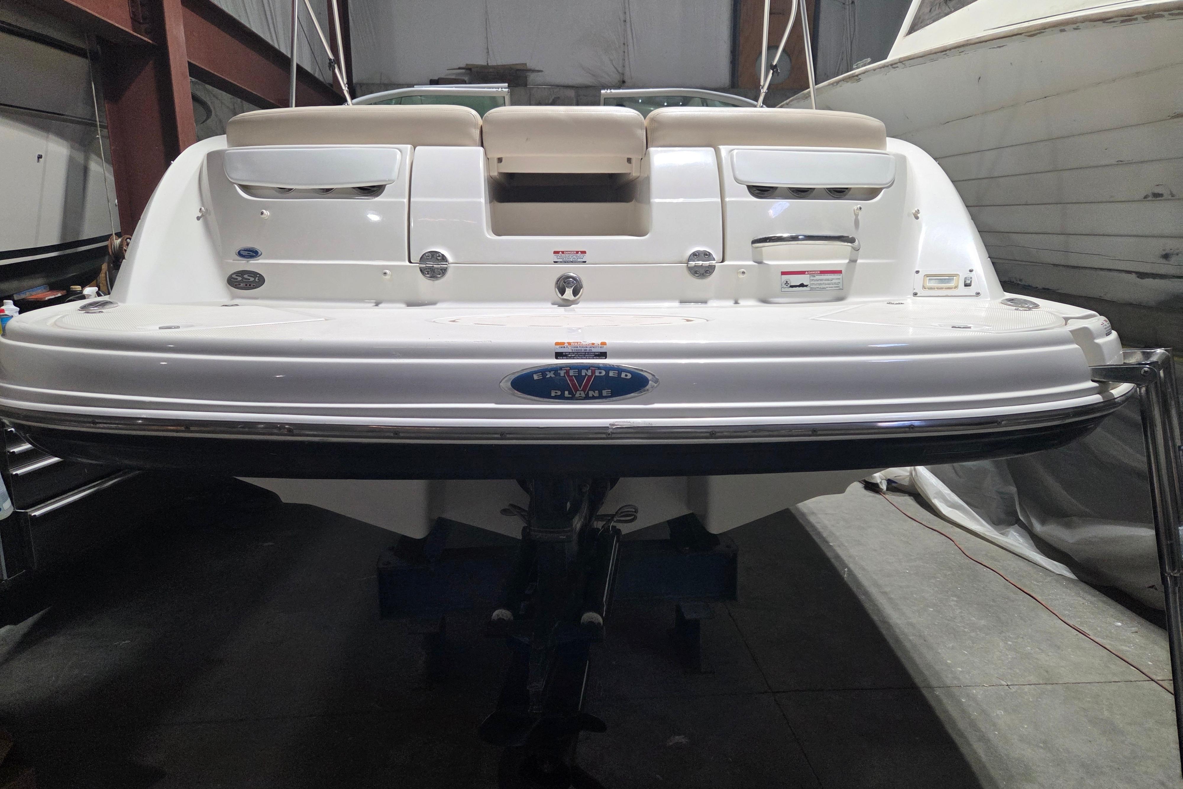 2006 Chaparral 236 SSi boat rear view in a storage facility.