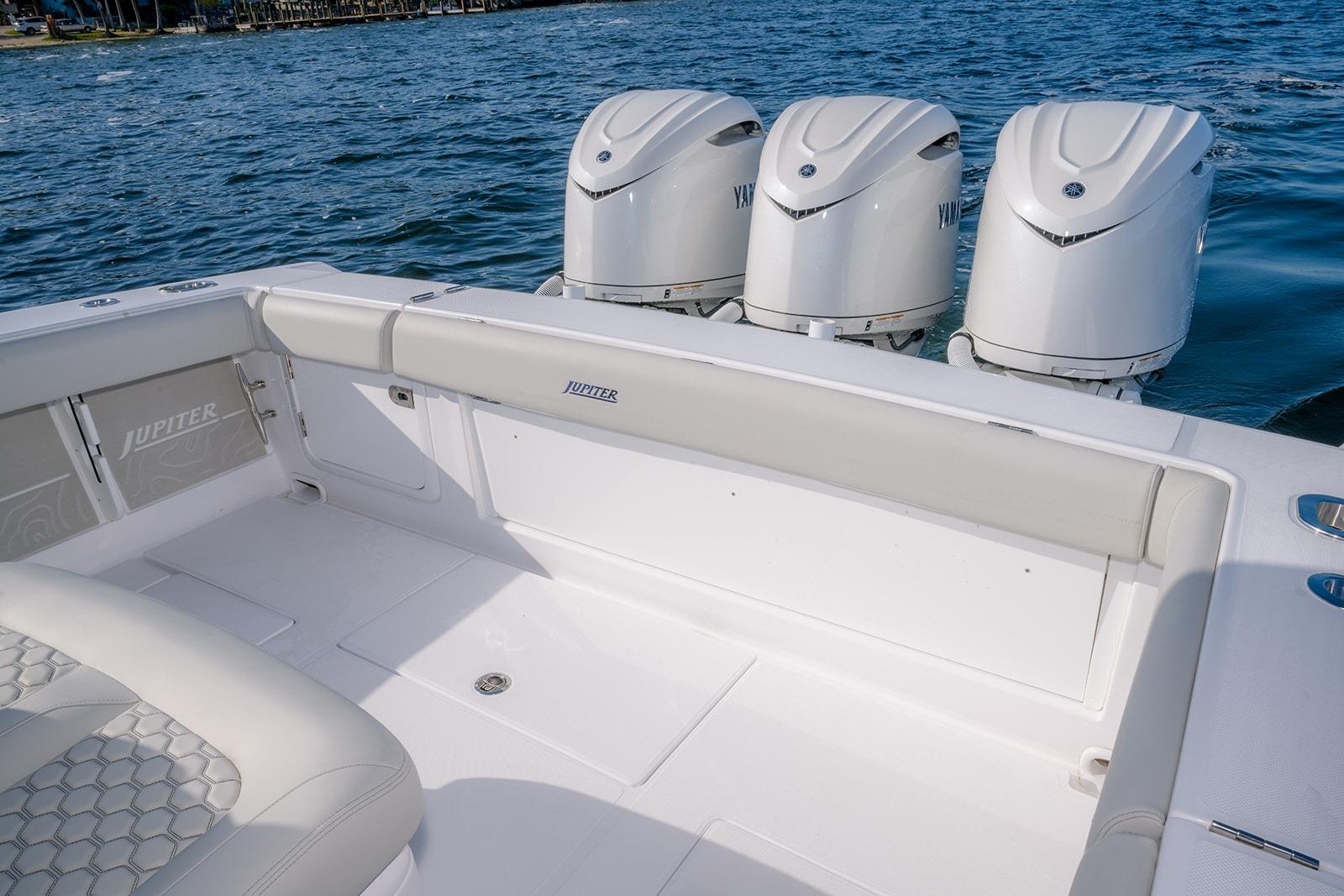 2026 Jupiter 340LS boat with triple outboard engines on a calm sea.