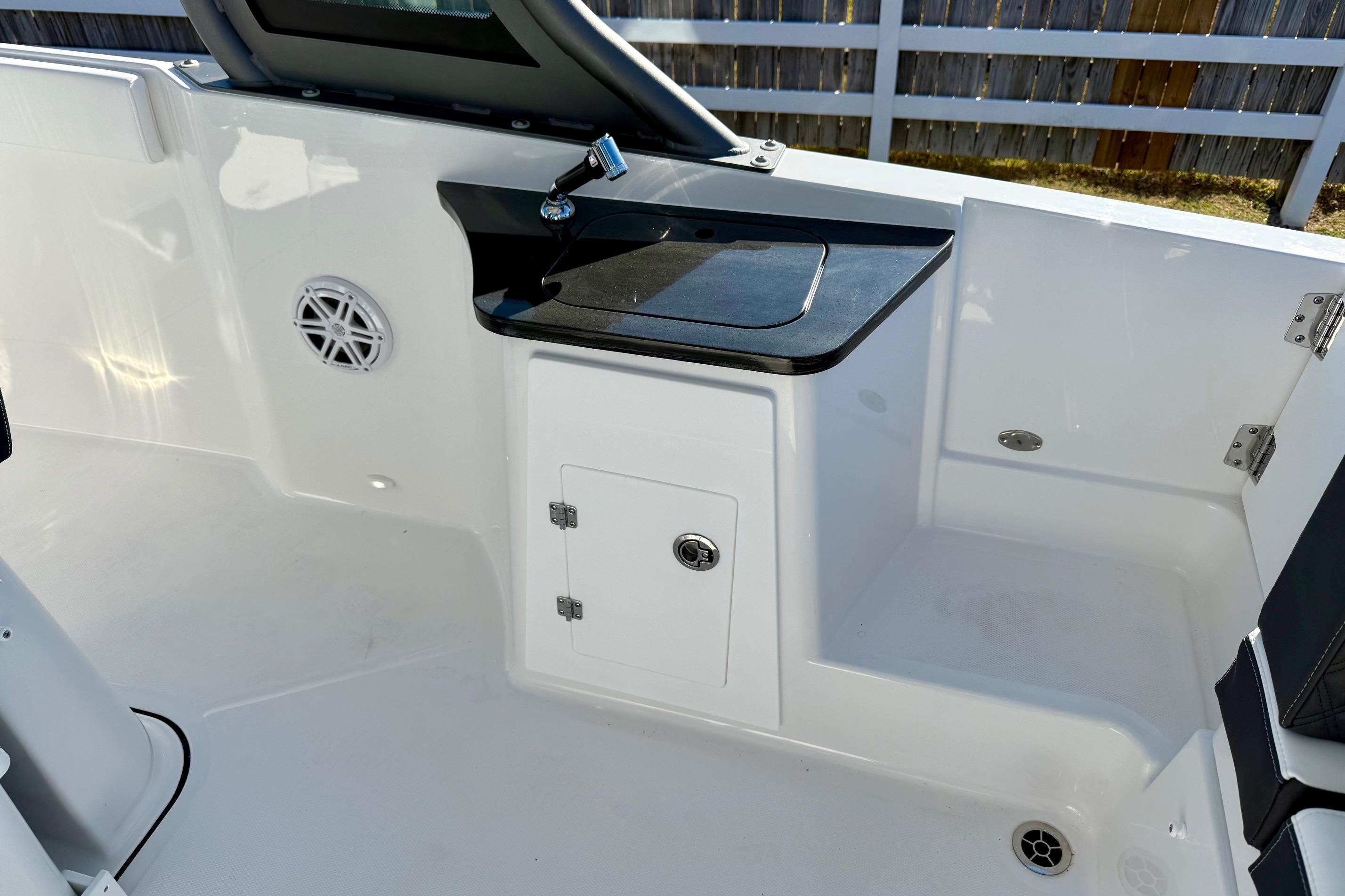 Interior of 2026 Monterey Elite 27 OB with storage and speaker.