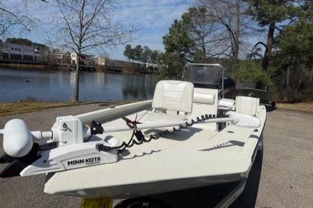 2024 Ranger RB190 boat with Minn Kota trolling motor by a scenic lake.