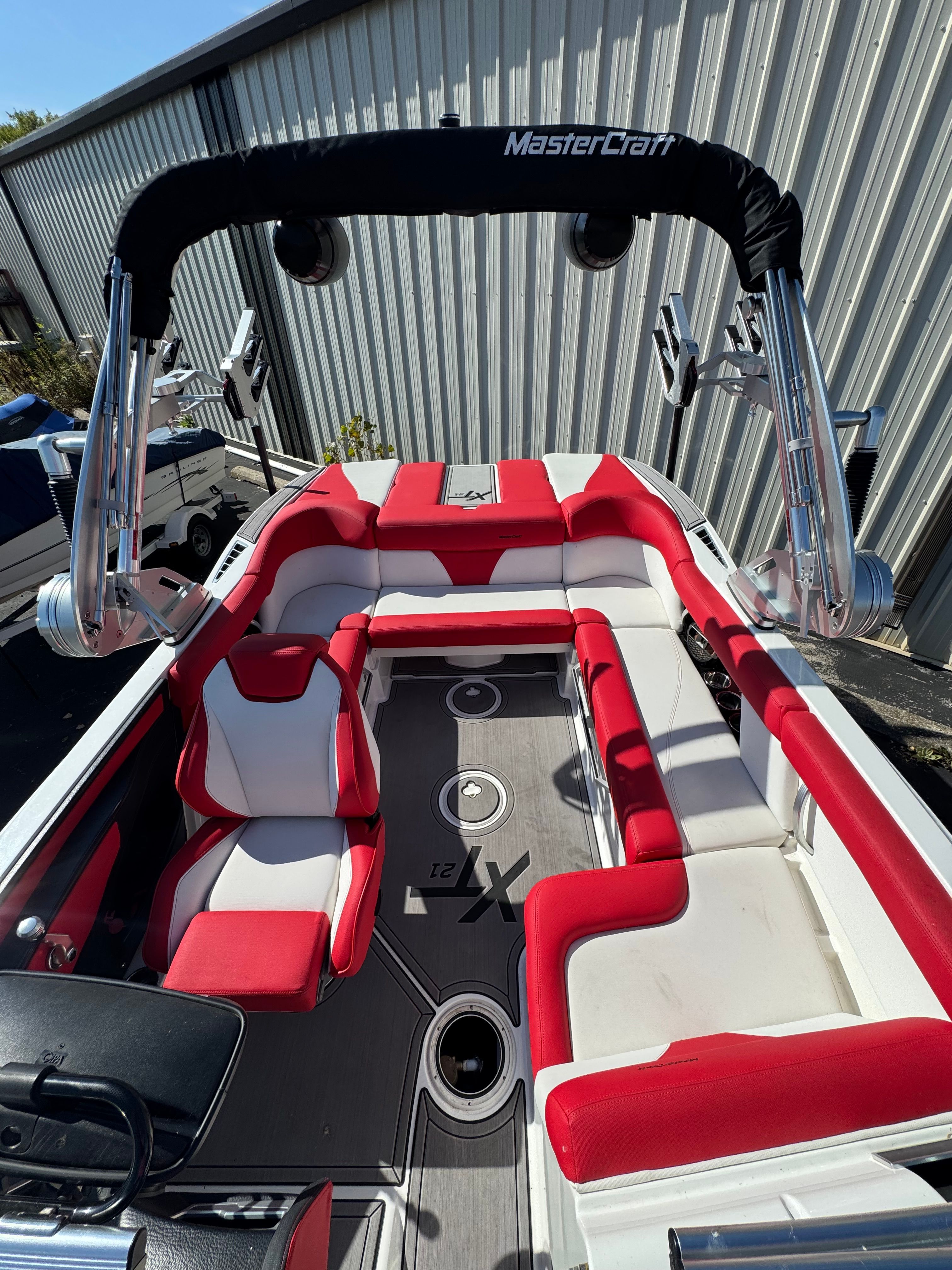 Interior of a 2019 Master XT21 boat with red seating.