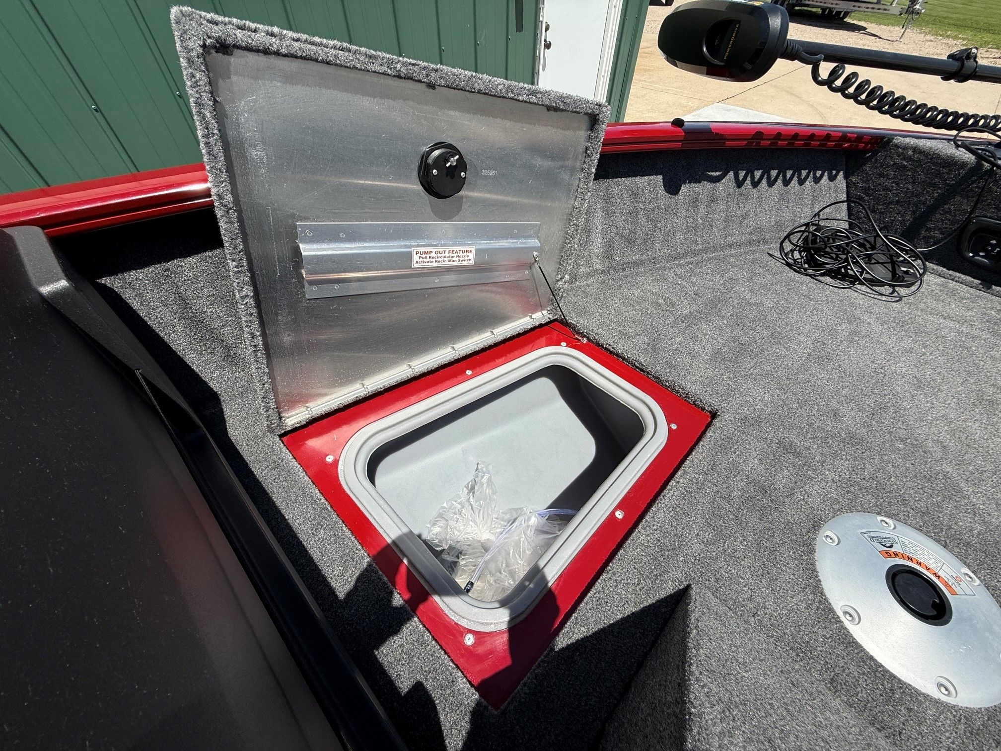 Tracker Pro Guide V175 2024, open storage compartment on boat.